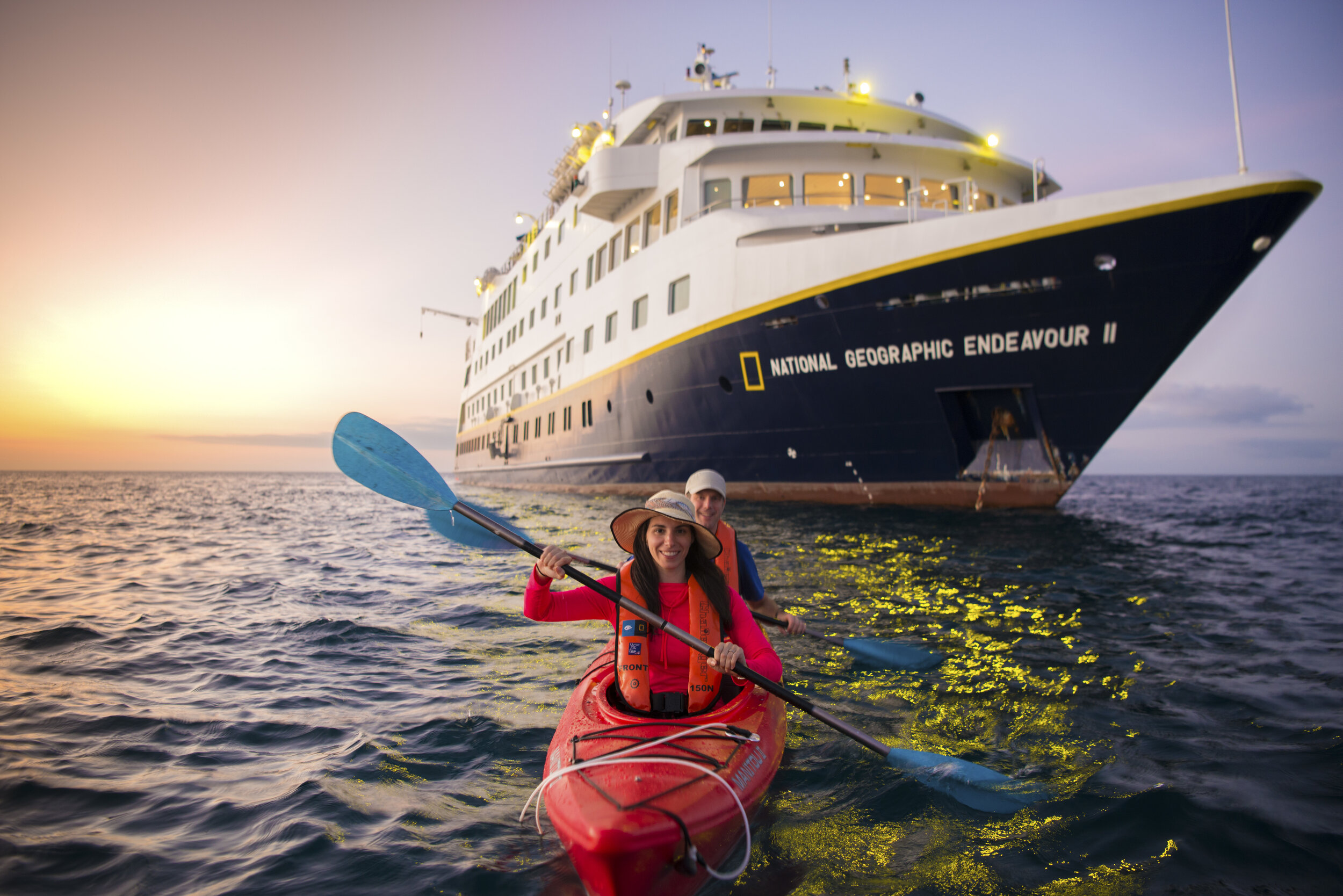   Guests kayaking near the National Geographic Endeavour II (photo credit: Lindblad Expeditions)  