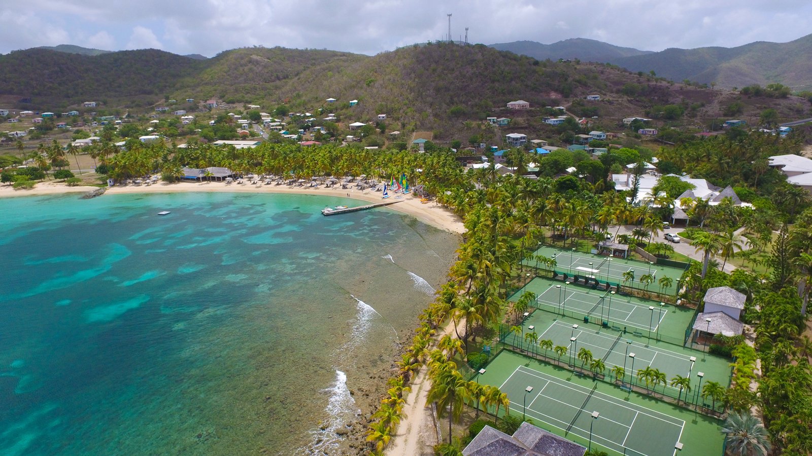Tennis courts and private beach at Curtain Bluff in Antigua