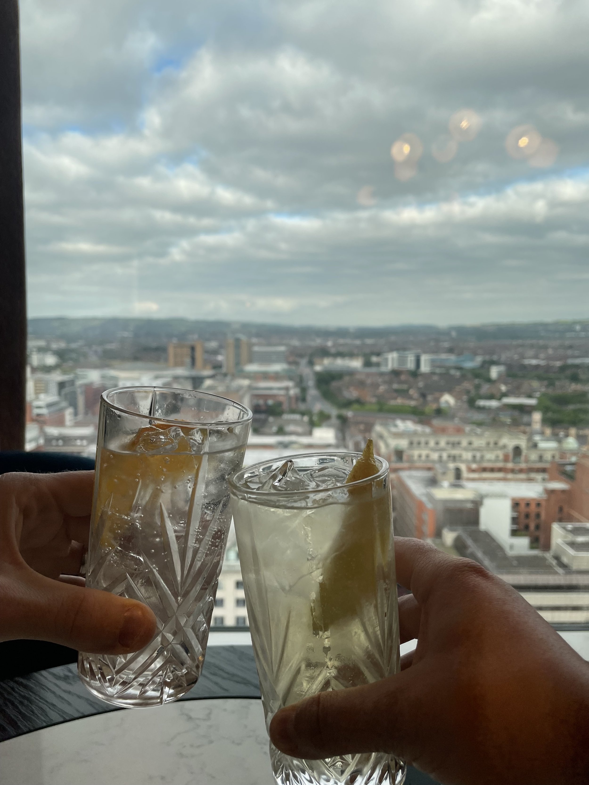 Drinks in the Observatory in the Grand Central Hotel in Belfast, Northern Ireland with city views