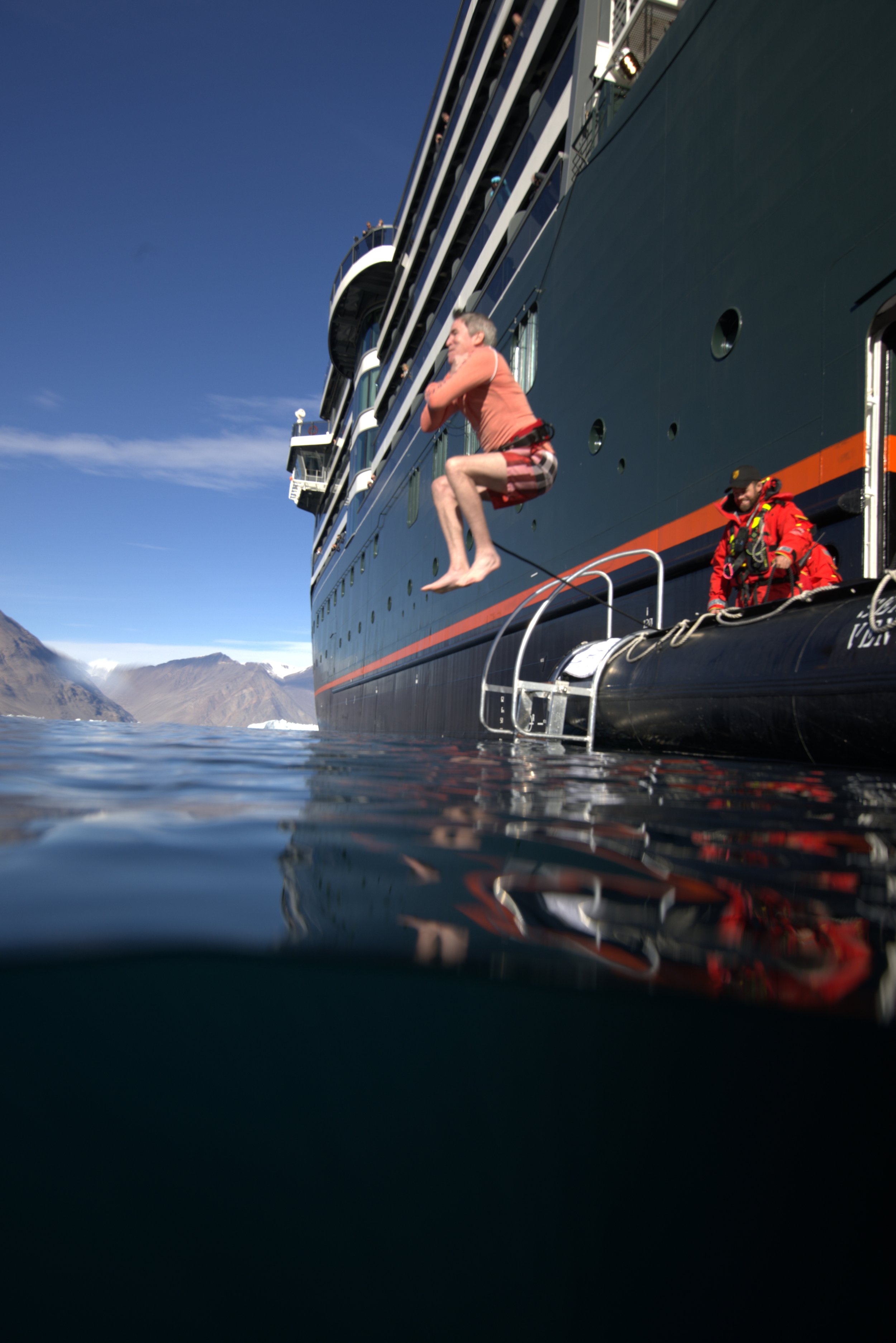 Seabourn guest jumping for an ice plunge in the Arctic