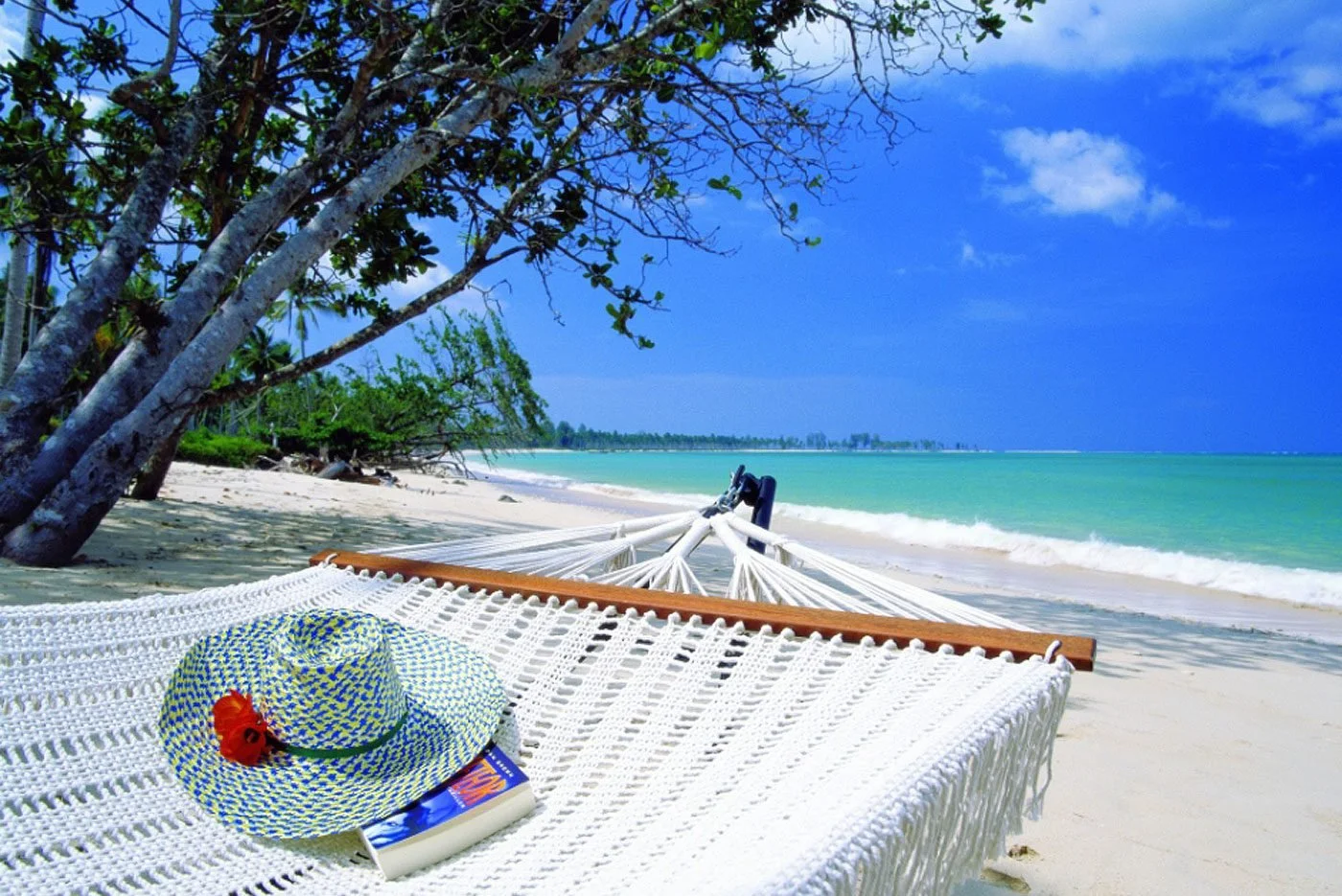 A relaxing time reading in a hammock at The Sarojin in Khao Lak, southern Thailand