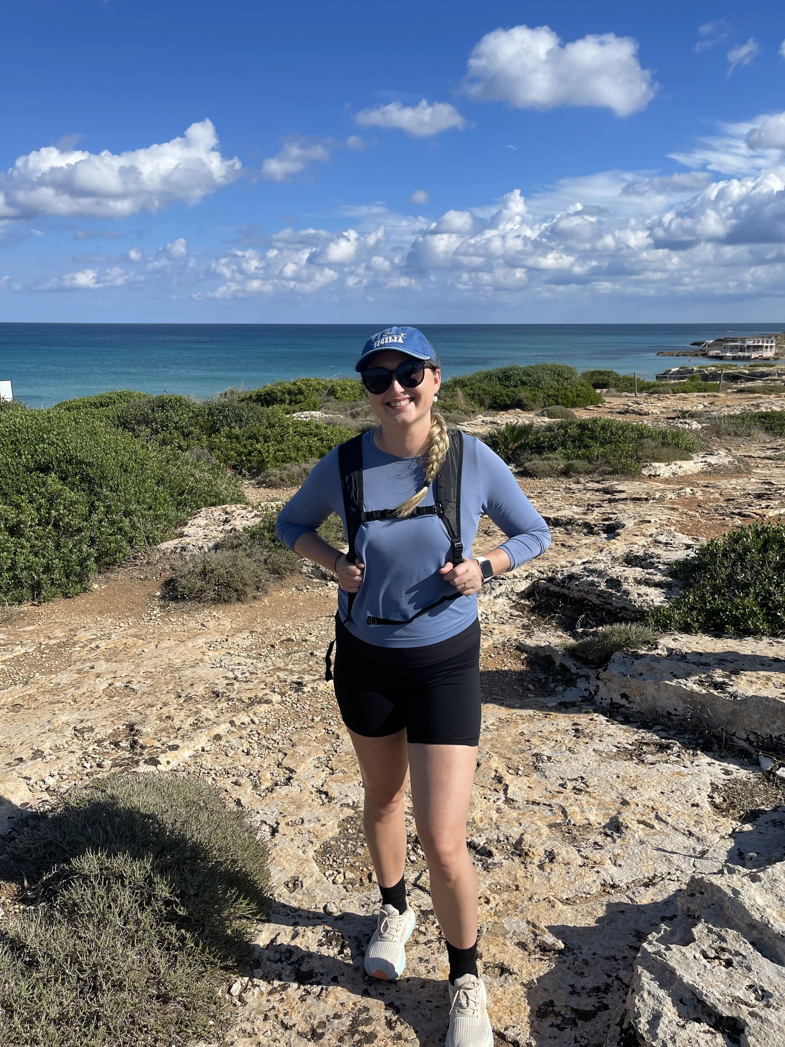 Erika from Poe Travel on a coastal beach hike with Butterfield and Robinson