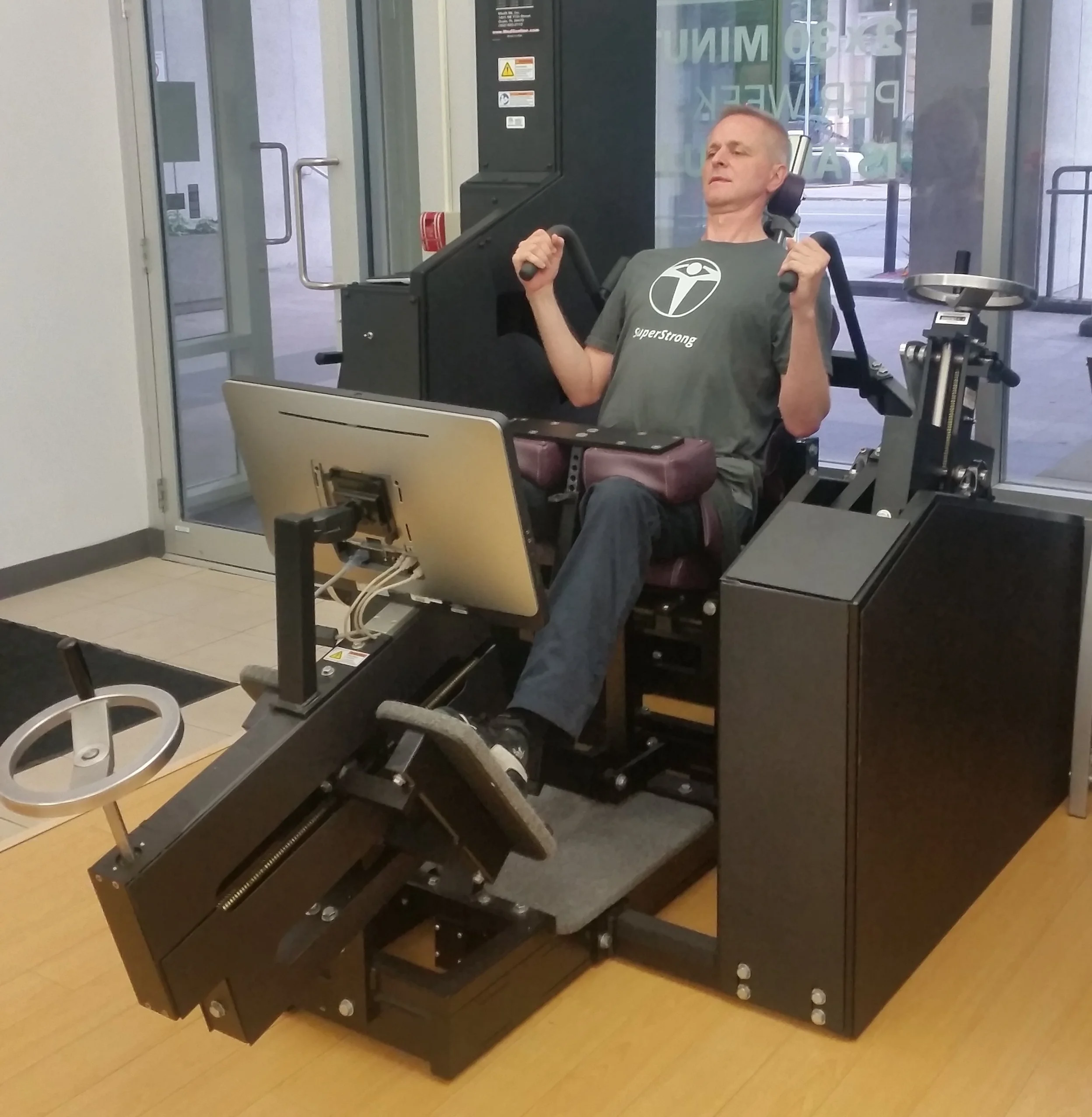 Thomas, one of the New Element Training instructors, on the MedX Lumbar Extension Machine
