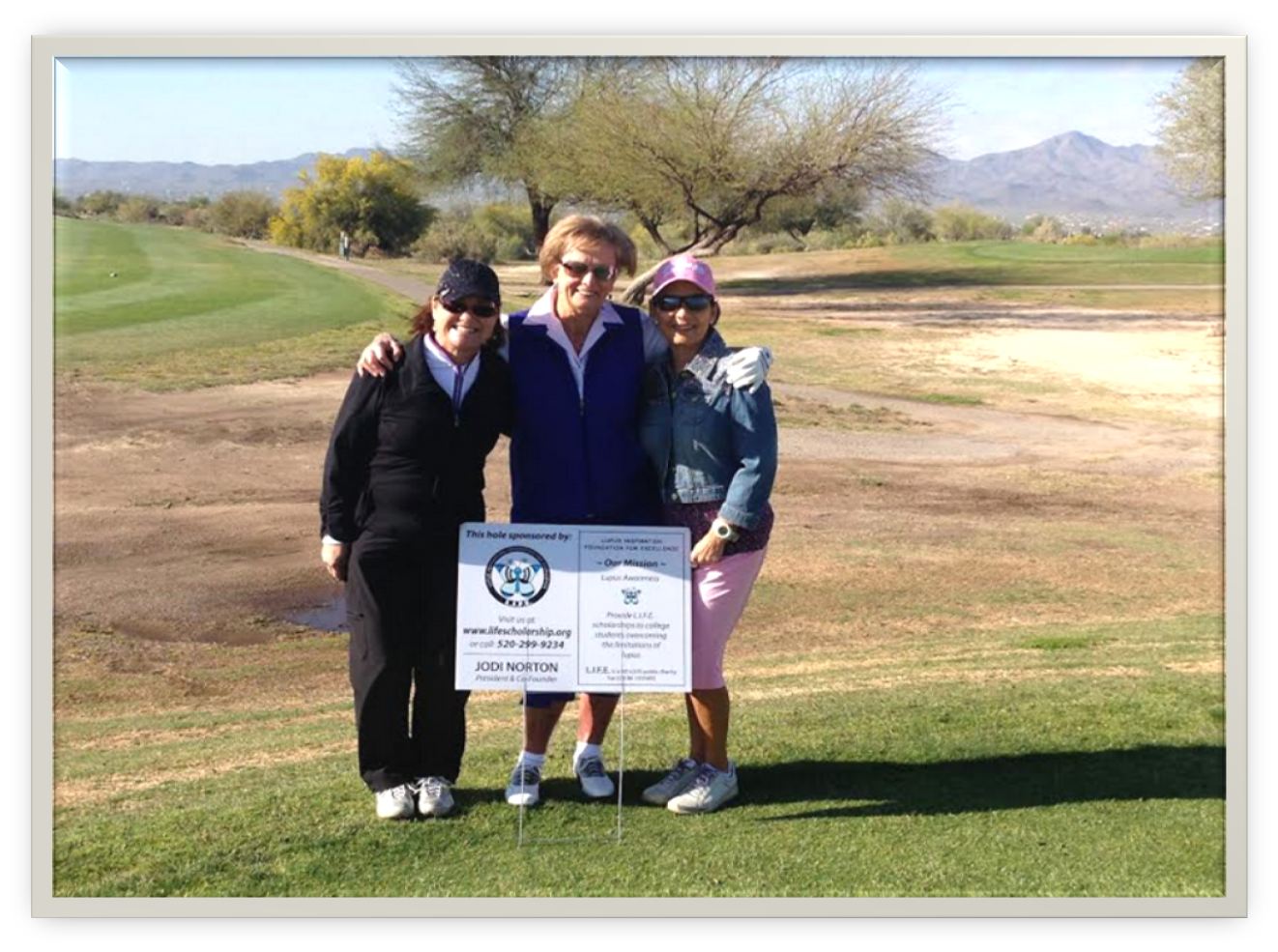 Three ladies participating in the Diva's Golf Tournament