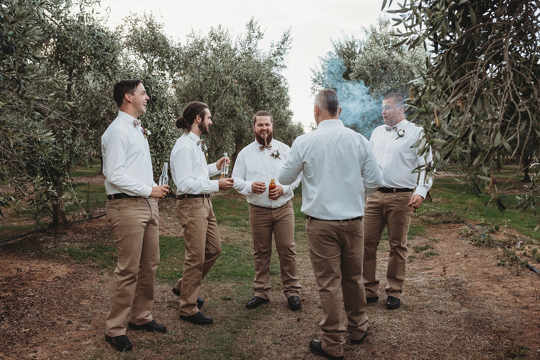 groom and groomsmen smoking cigars