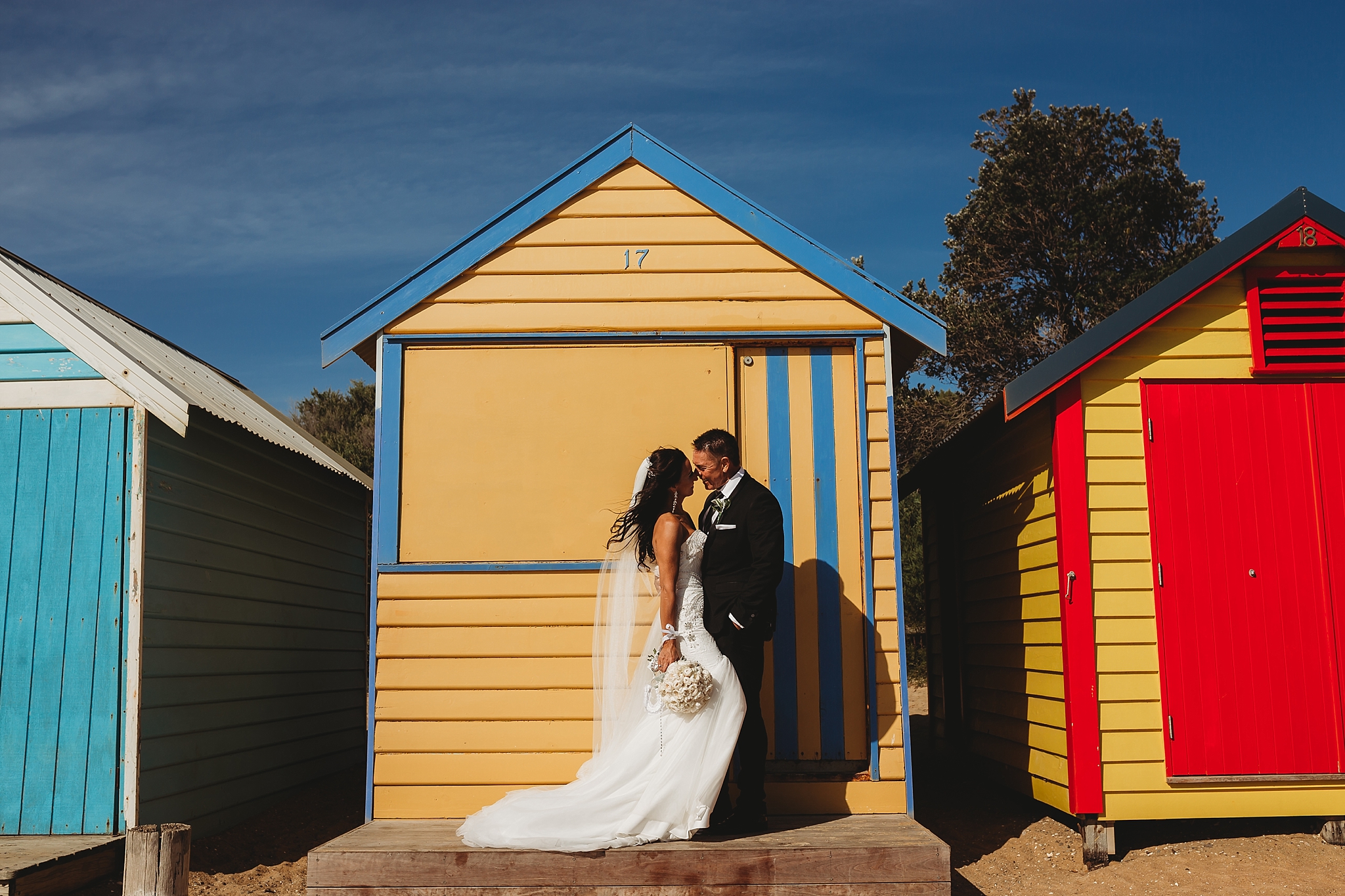 bride and groom at brighton beach boxes