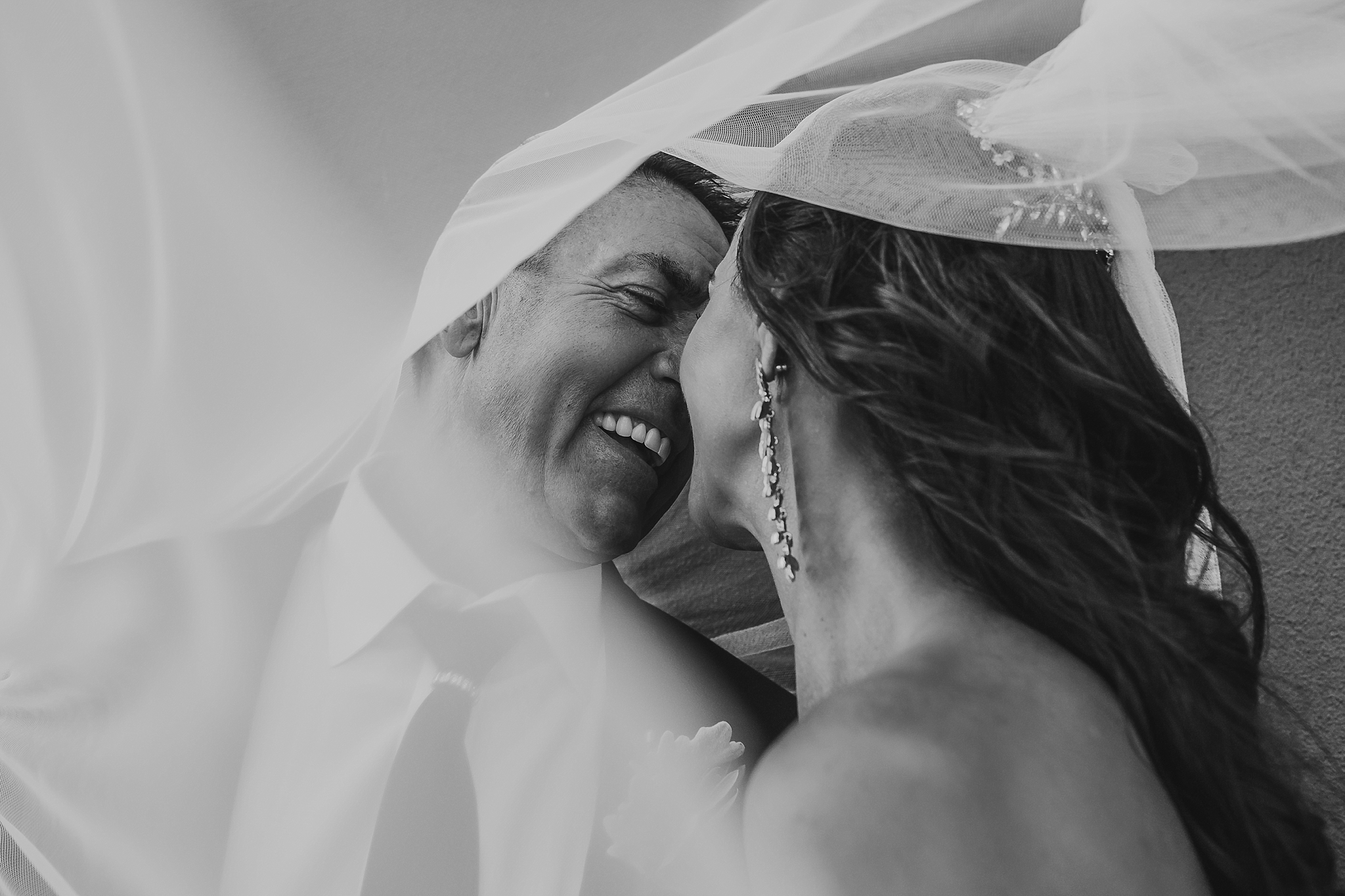 bride and groom under the veil at brighton savoy