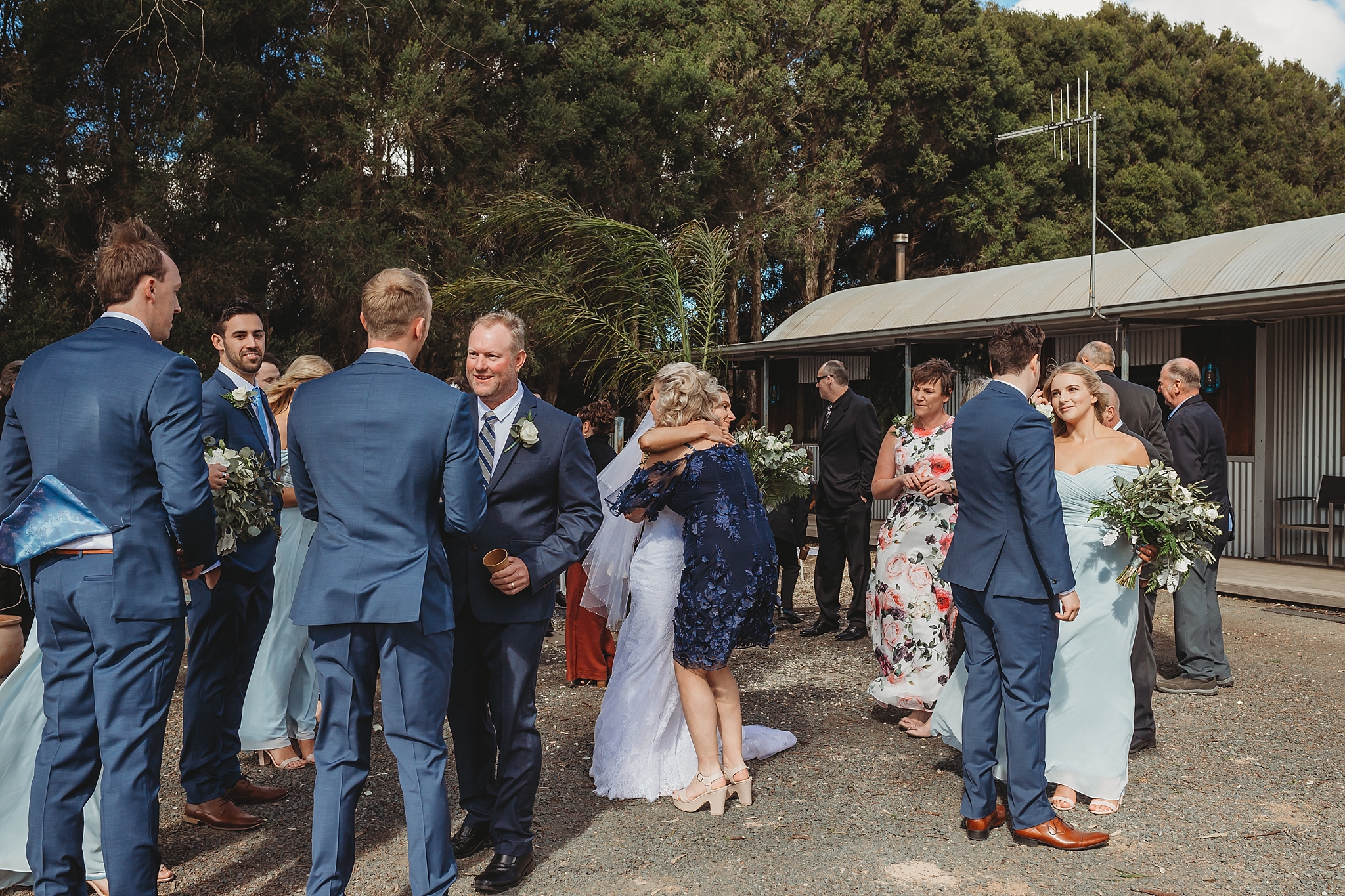 Mum hugging bride