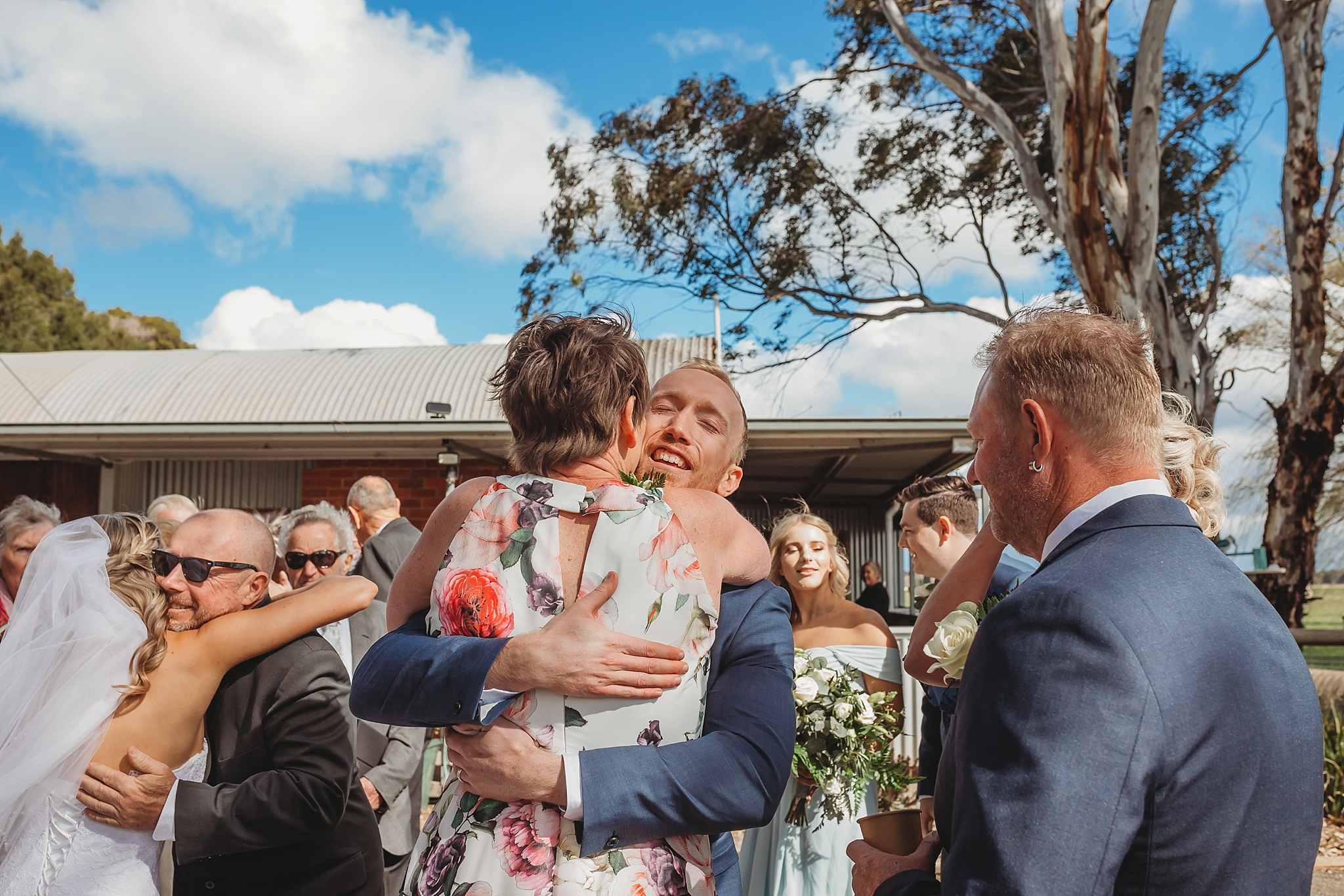 mum hugging groom