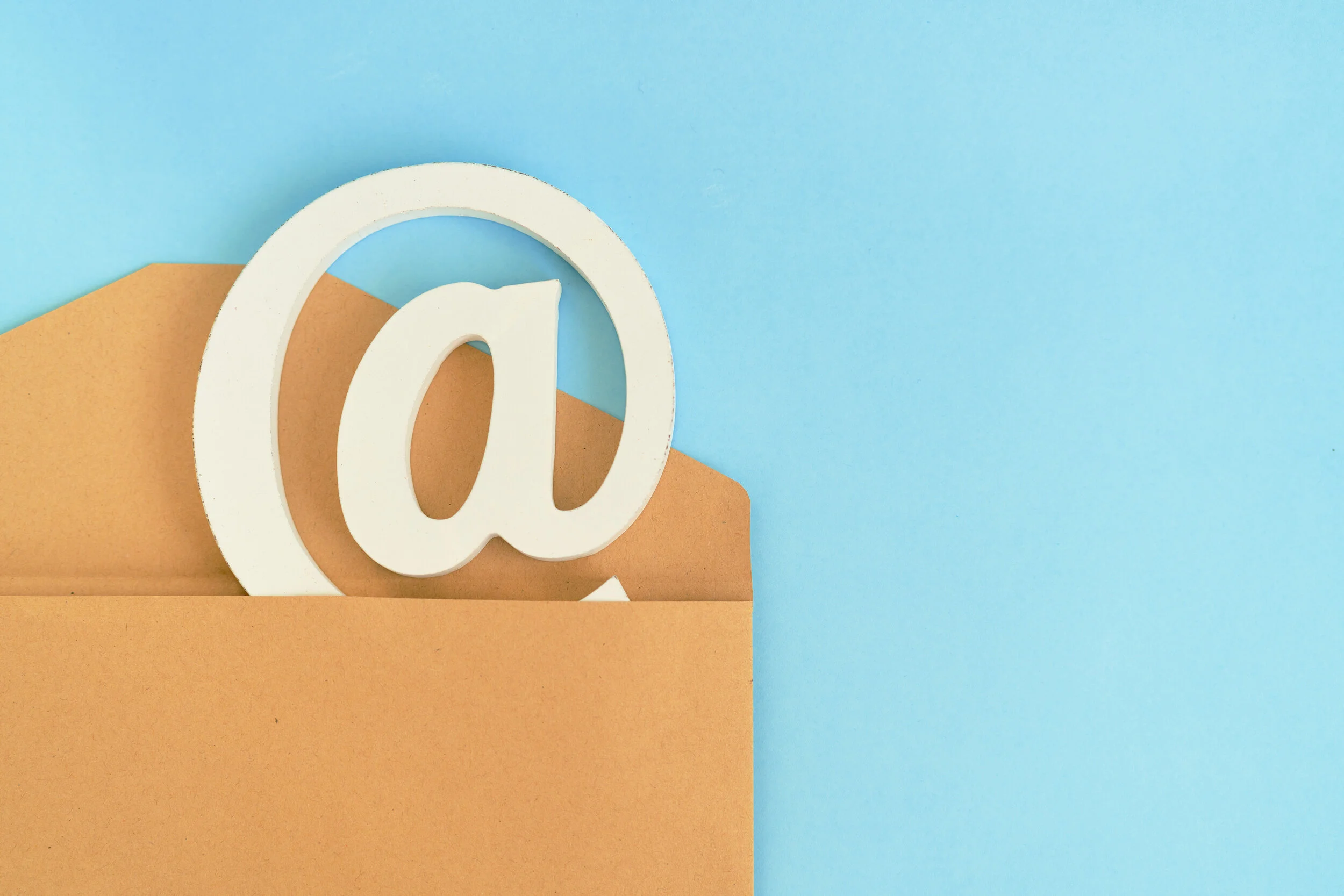 brown-envelope-with-e-mail-sign-blue-background.jpg