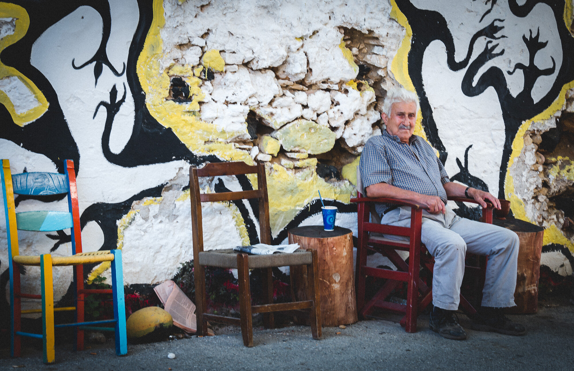 www.stemajourneys.com-crete-old-man-sitting-in-modern-chairs.jpg