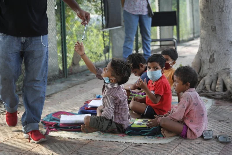 Indian Couple Run Street-Side Classes for Poor Students