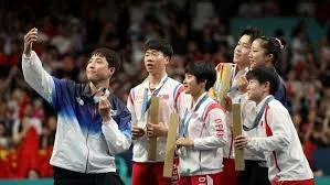 North and South Korean Athletes Share an Olympic Podium — and Take a Selfie