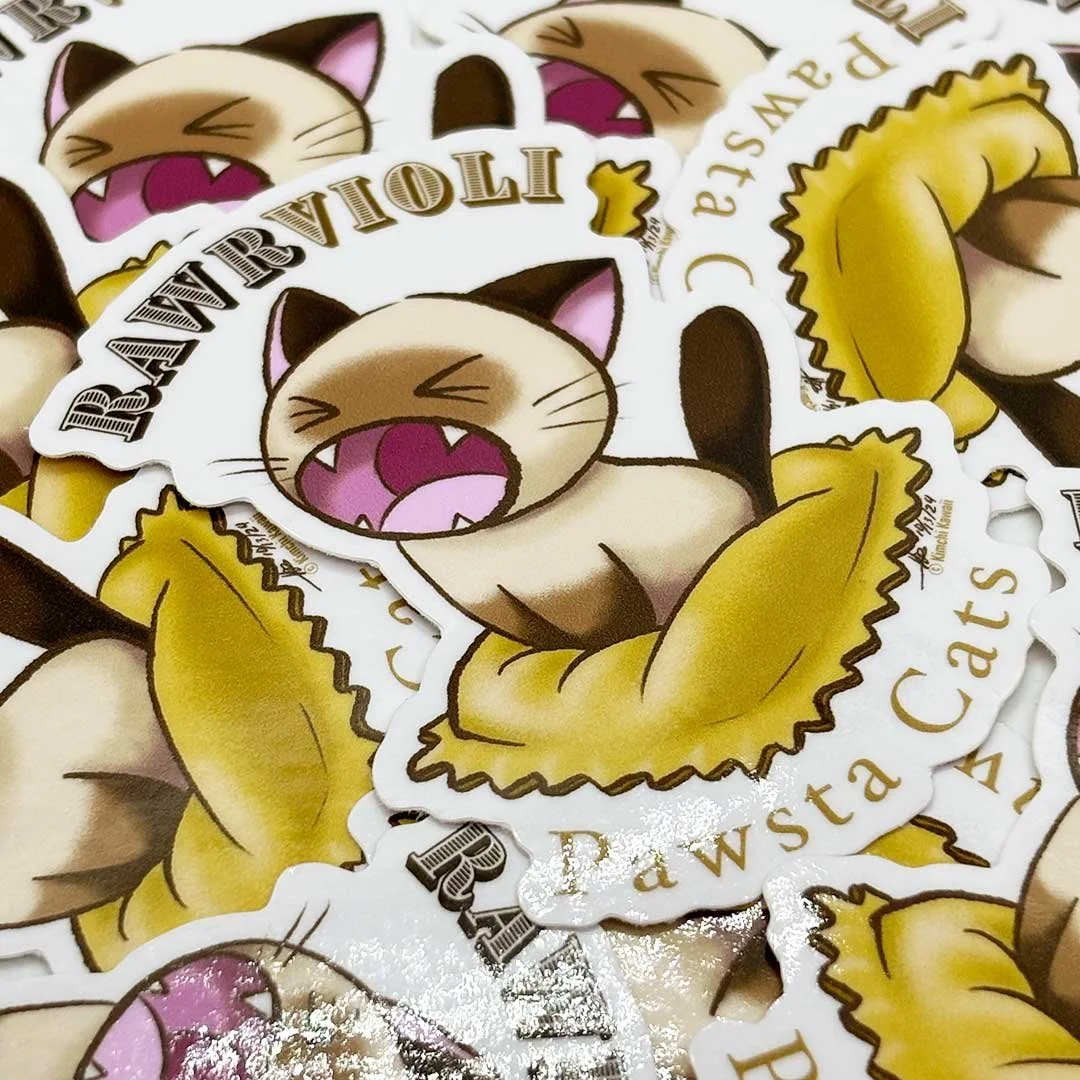 Sticker of a siamese cat with its mouth open sitting on a ravioli pasta pillow. Words around it read 'Rawrvioli' and 'Pawsta Cats'.