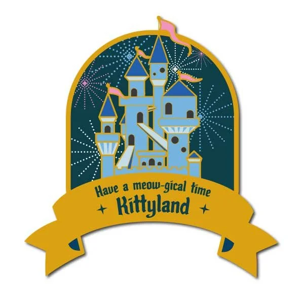 Pin mockup of a blue fairy tale castle with fireworks and a banner on the bottom that says 'Have a meowgical time at Kittyland'.