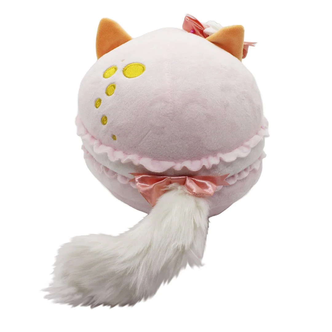 Back of Champagne macaron kitty plush showing embroidered bubbles and furry tail with a pink bow.