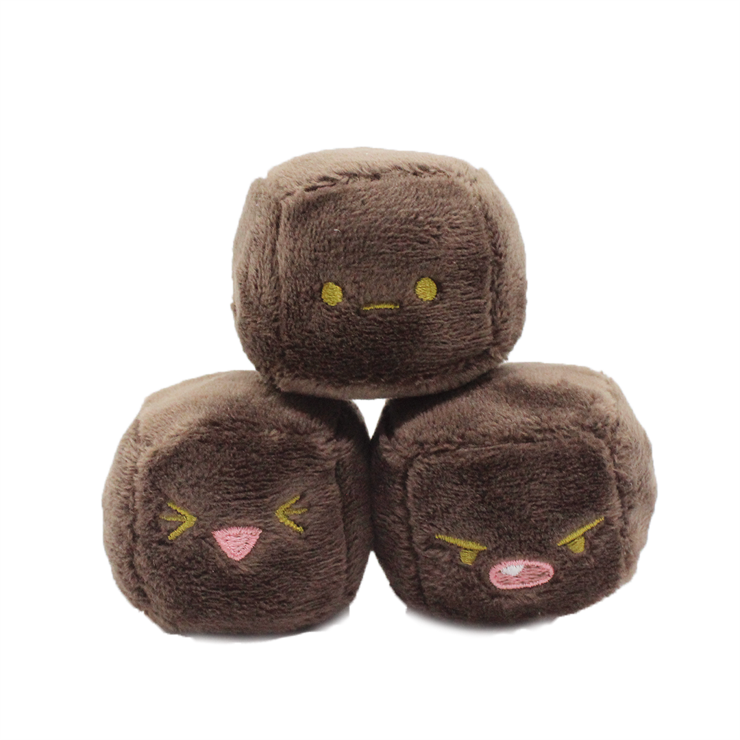 Plush cube wombat poops with apathetic, angry and happy emotions.