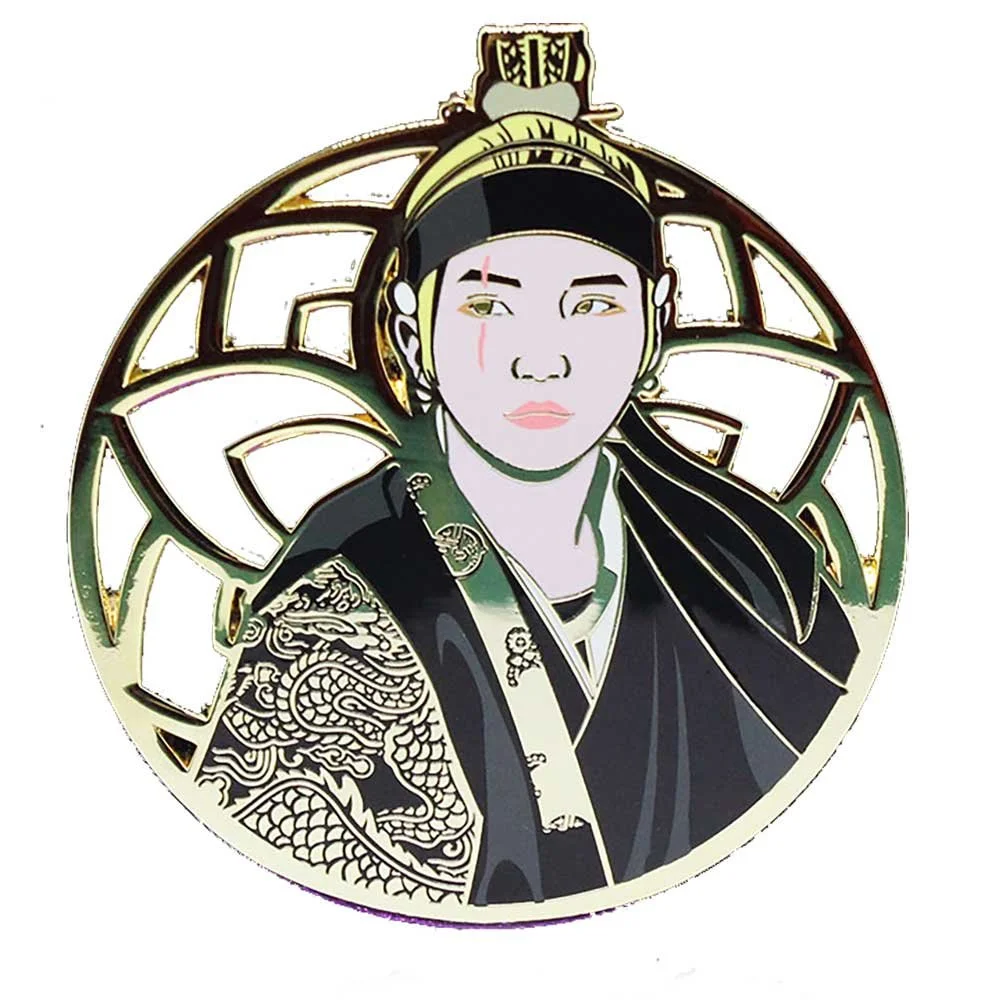 Enamel pin of AgustD musician wearing a black and gold hanbok.