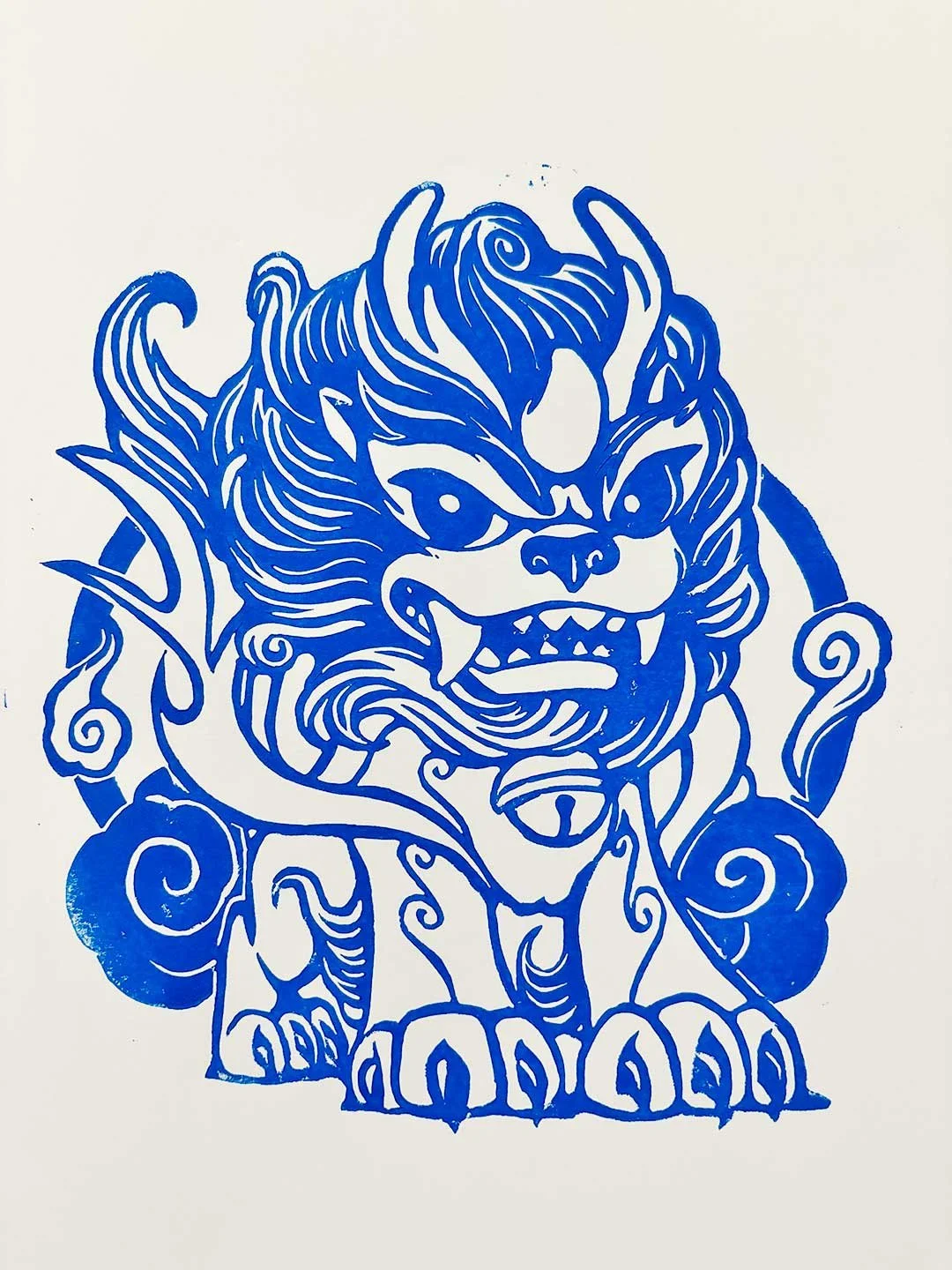 Blue print of a Korean haetae looking angry.