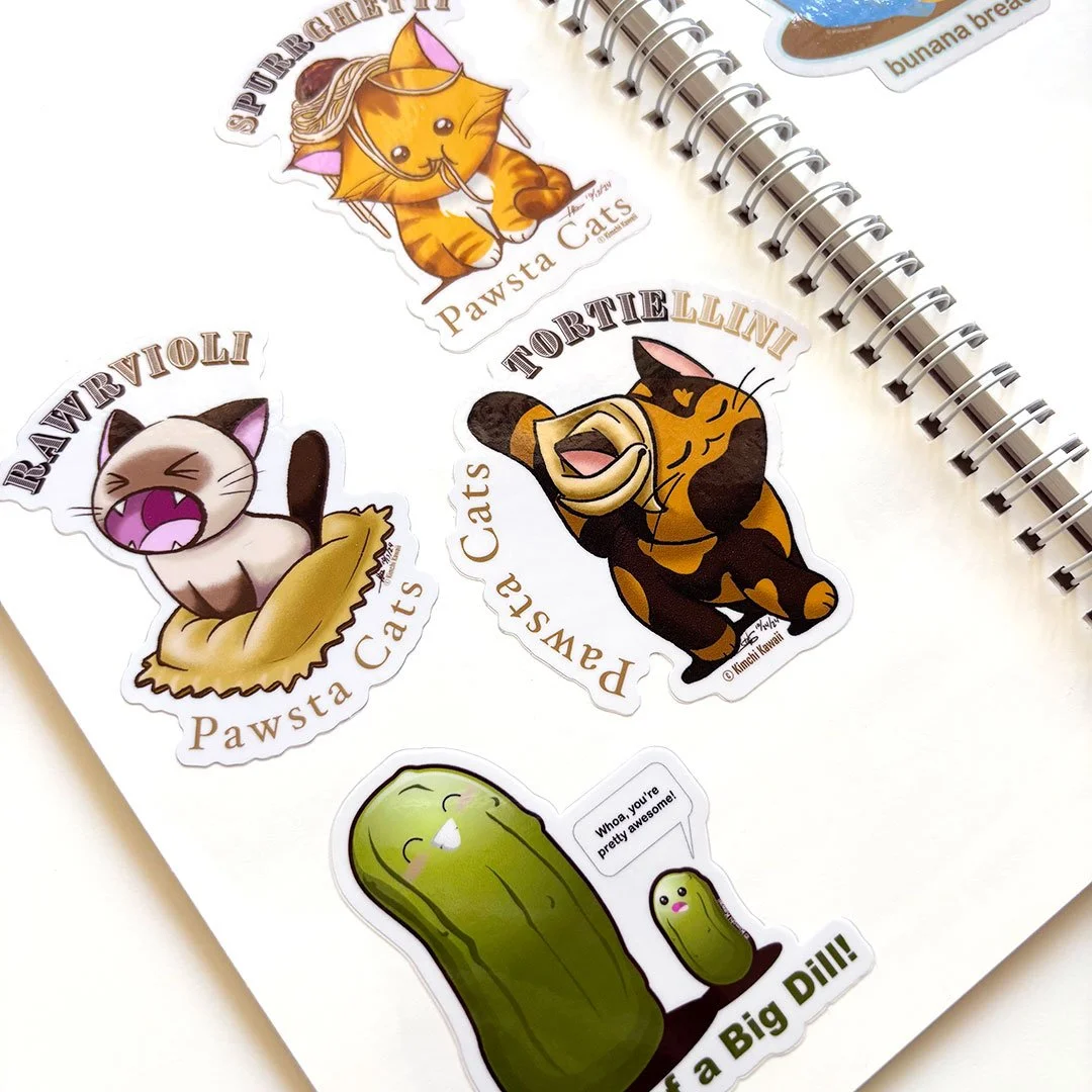 Cat and pickle stickers inside a sticker album. (Copy)
