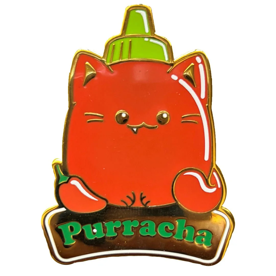 Pin of a cat shaped bottle of sriracha sauce. Text reads 'Purracha'.