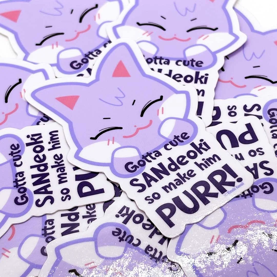 Sticker of a purple cat with the words 'Gotta cute Sandeoki so make him purr'.