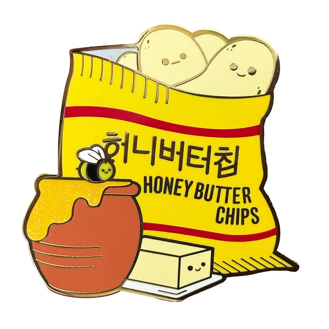 Cute honey butter chips with a pot of honey and stick of butter enamel pin.