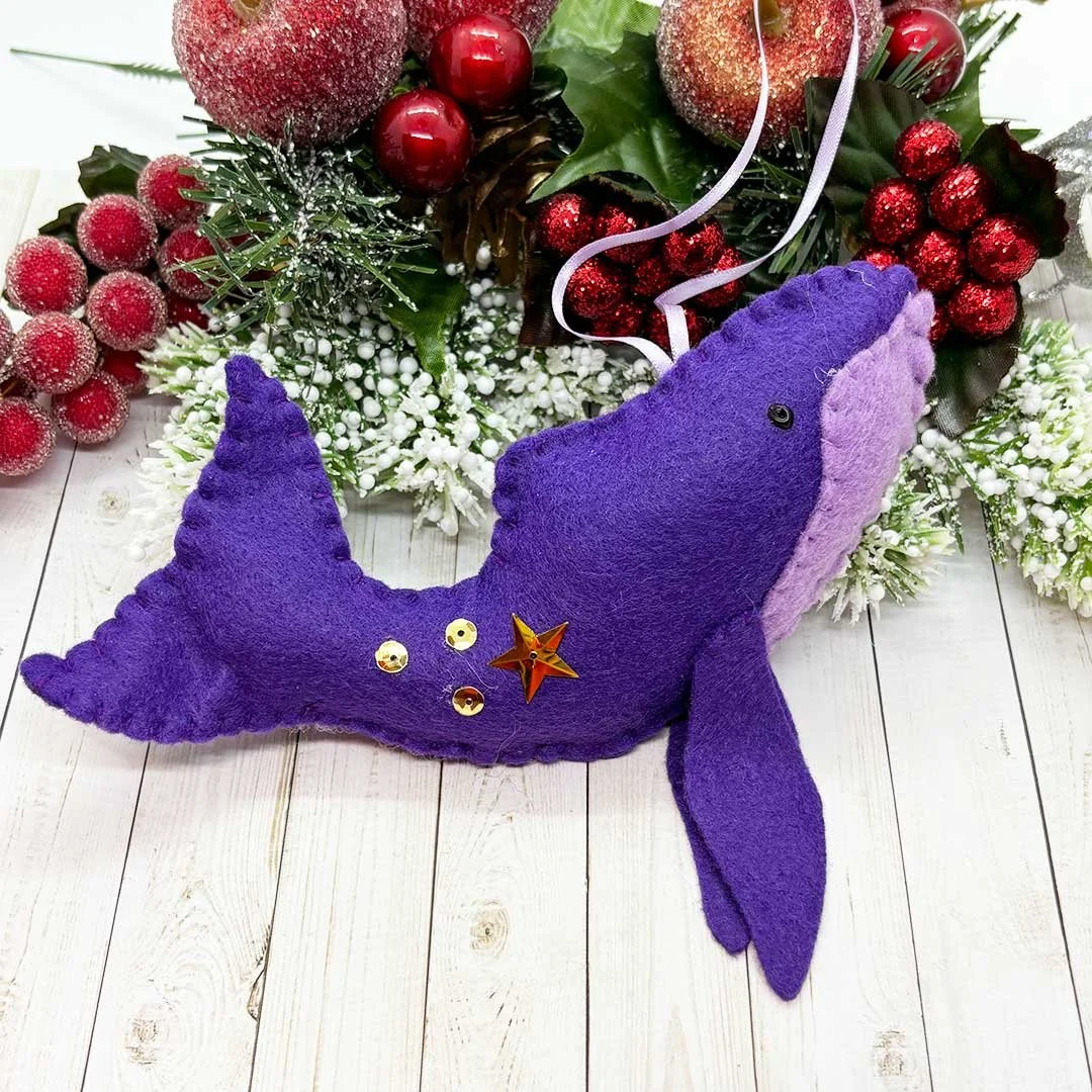 Purple whale with gold sequins.