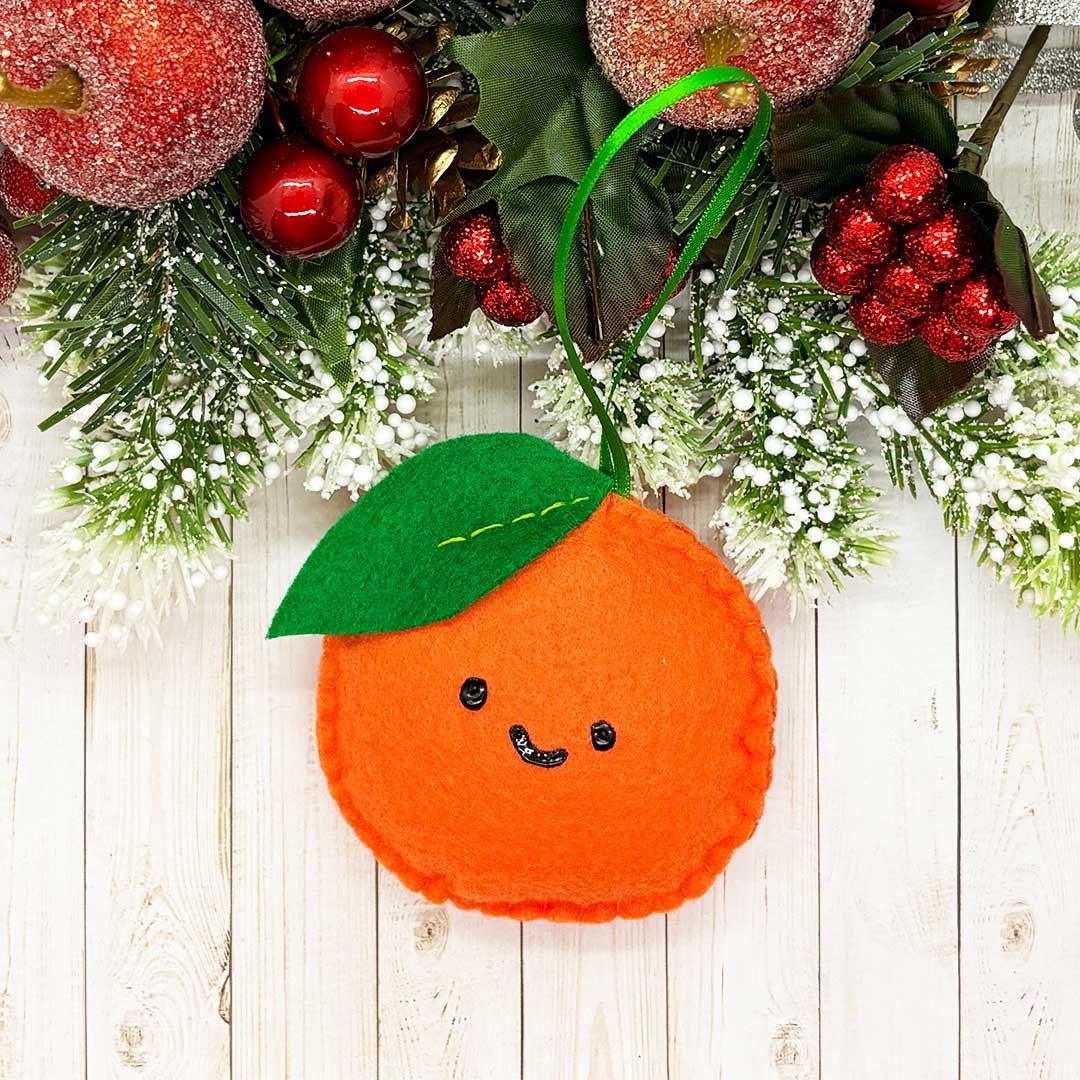 Felt orange Christmas tree ornament.