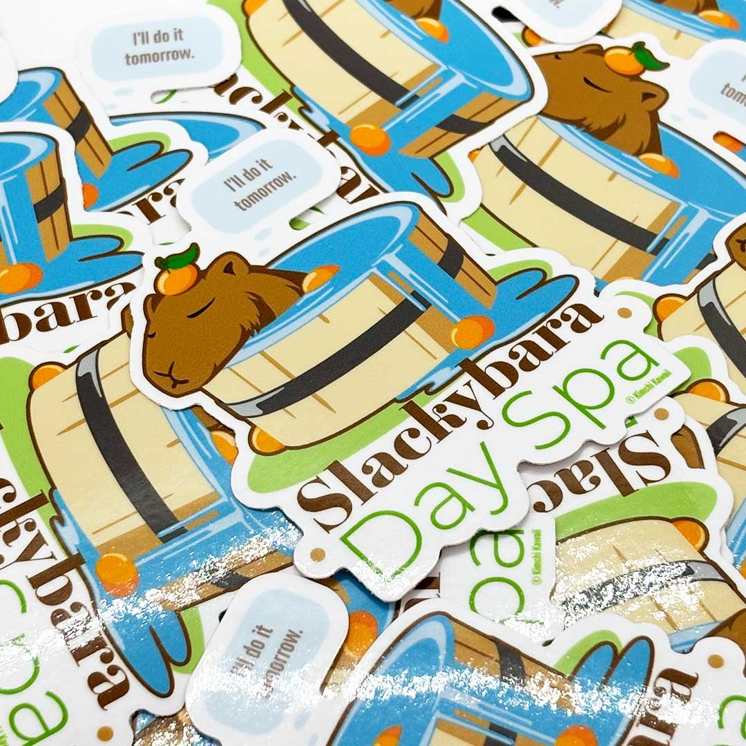 Capybara sitting in a spa with tangerines on it's head and a thought bubble saying 'I'll do it tomorrow'. Text on bottom reads 'Slackbara Day Spa'.
