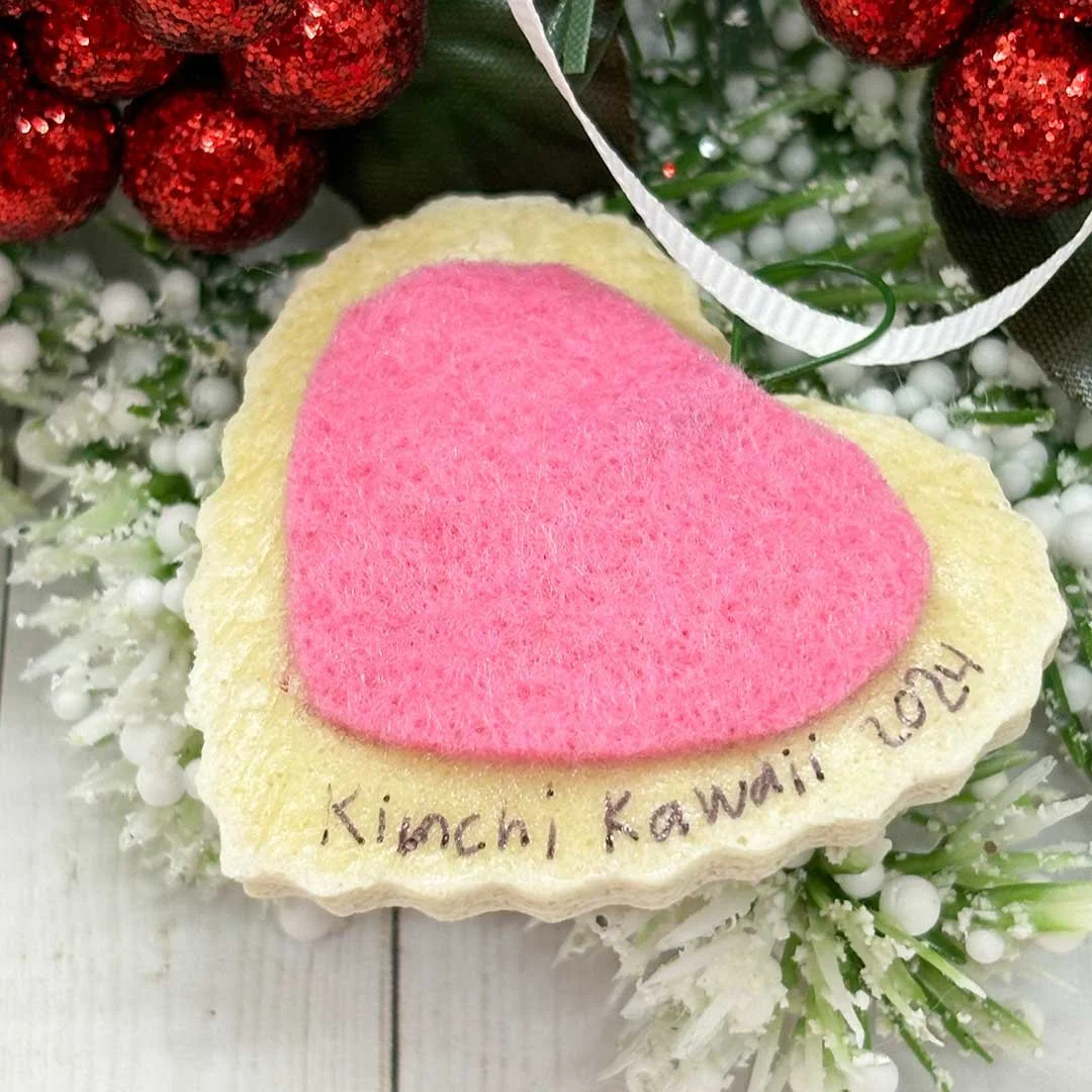 Back of a heart cookie ornament with felt and 'Kimchi Kawaii, 2024'.