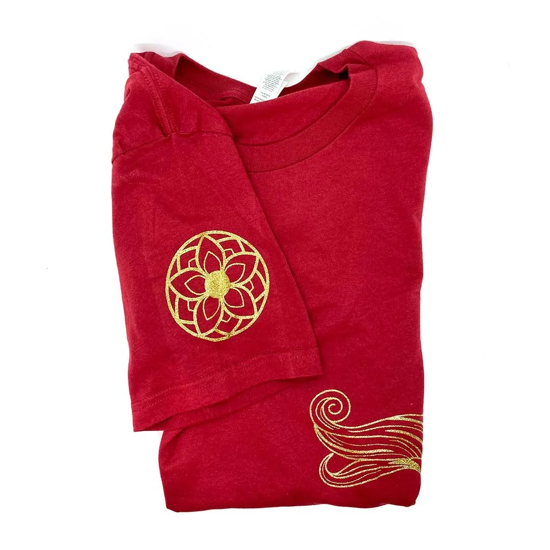 Sleeve detail on a red shirt showing a Korean flower design.