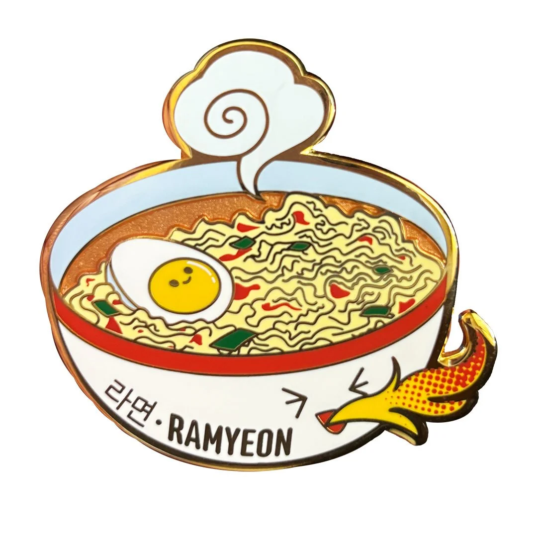 Ramyeon enamel pin with the bowl breathing fire.