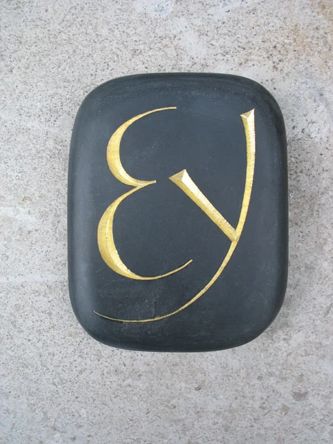 Gilded paperweight in Welsh slate.