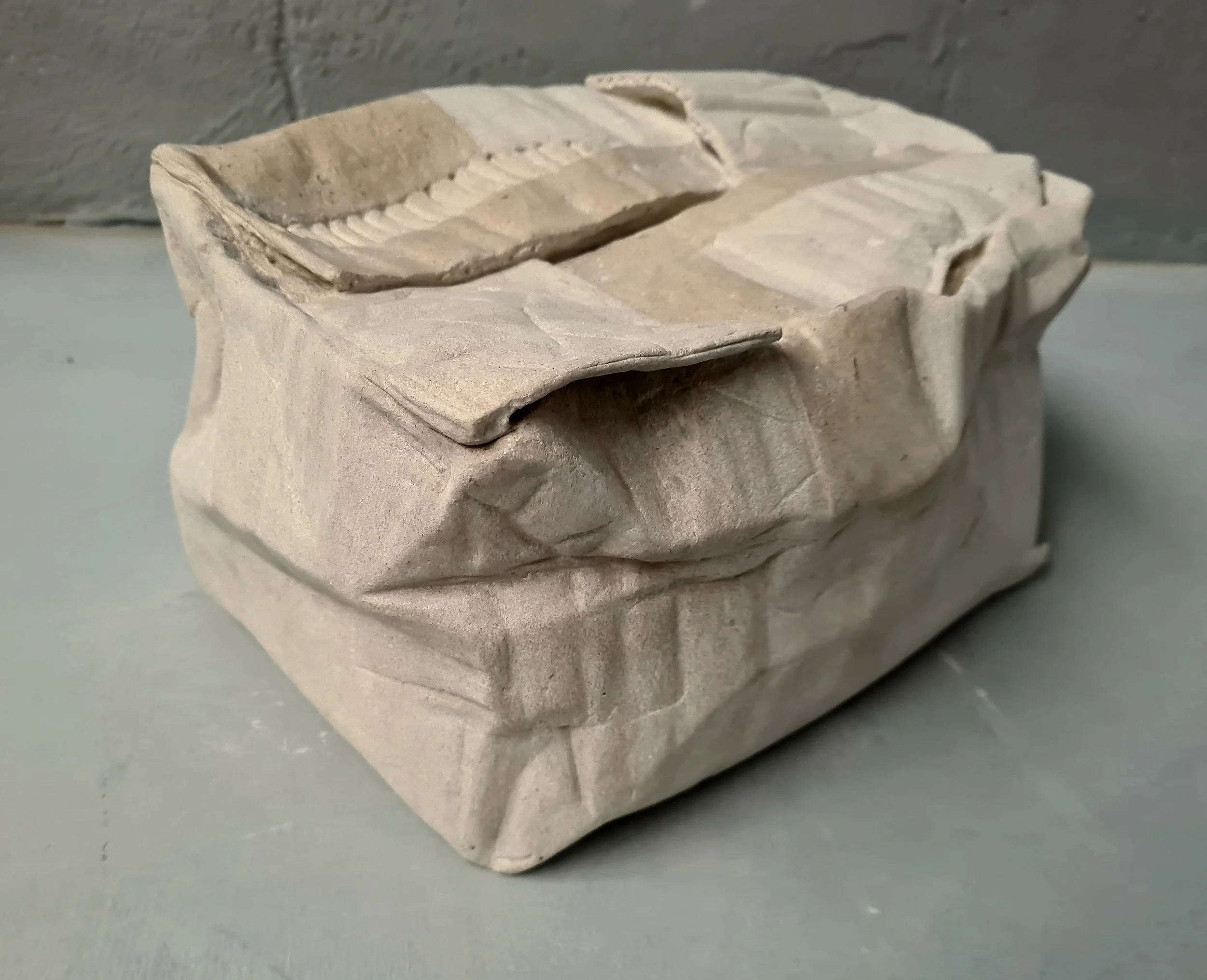 Crushed box with tape.