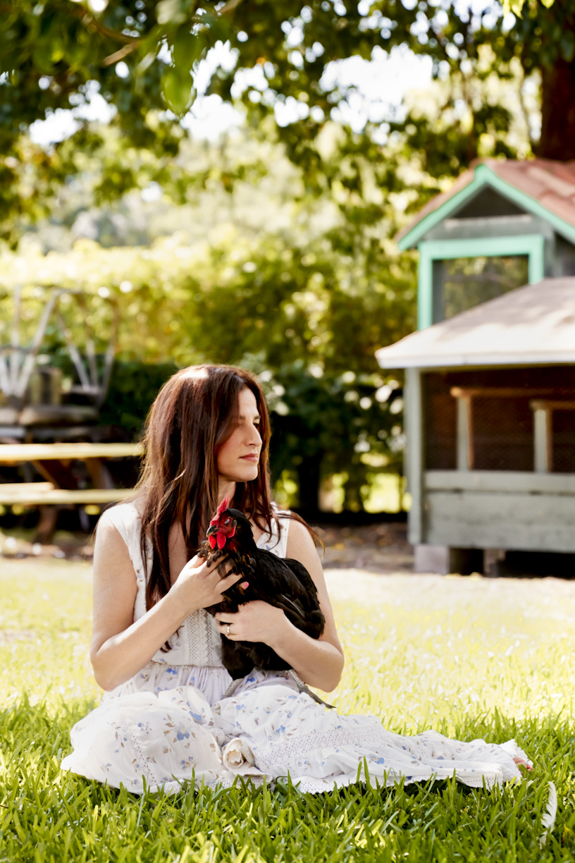 woman-holding-farm-chicken-lifestyle-photography.jpg