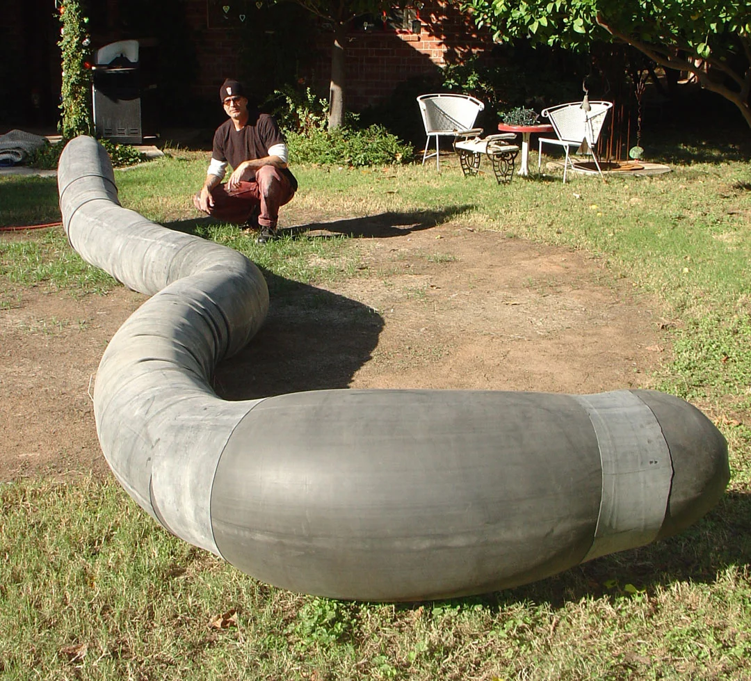 Pre-installation "WOMB #3", 2010, rubber and rope, 18' L