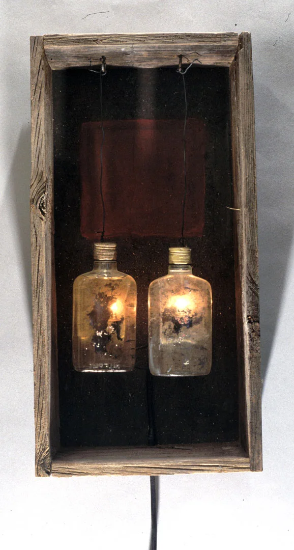 "Spirits #1", 1998, wood, bottles, alcohol and lighting element, 20" H