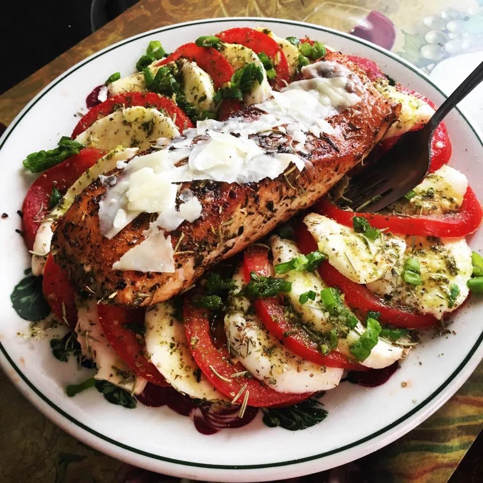 Tomatoe  Caprese Salad topped with Baked Salmon