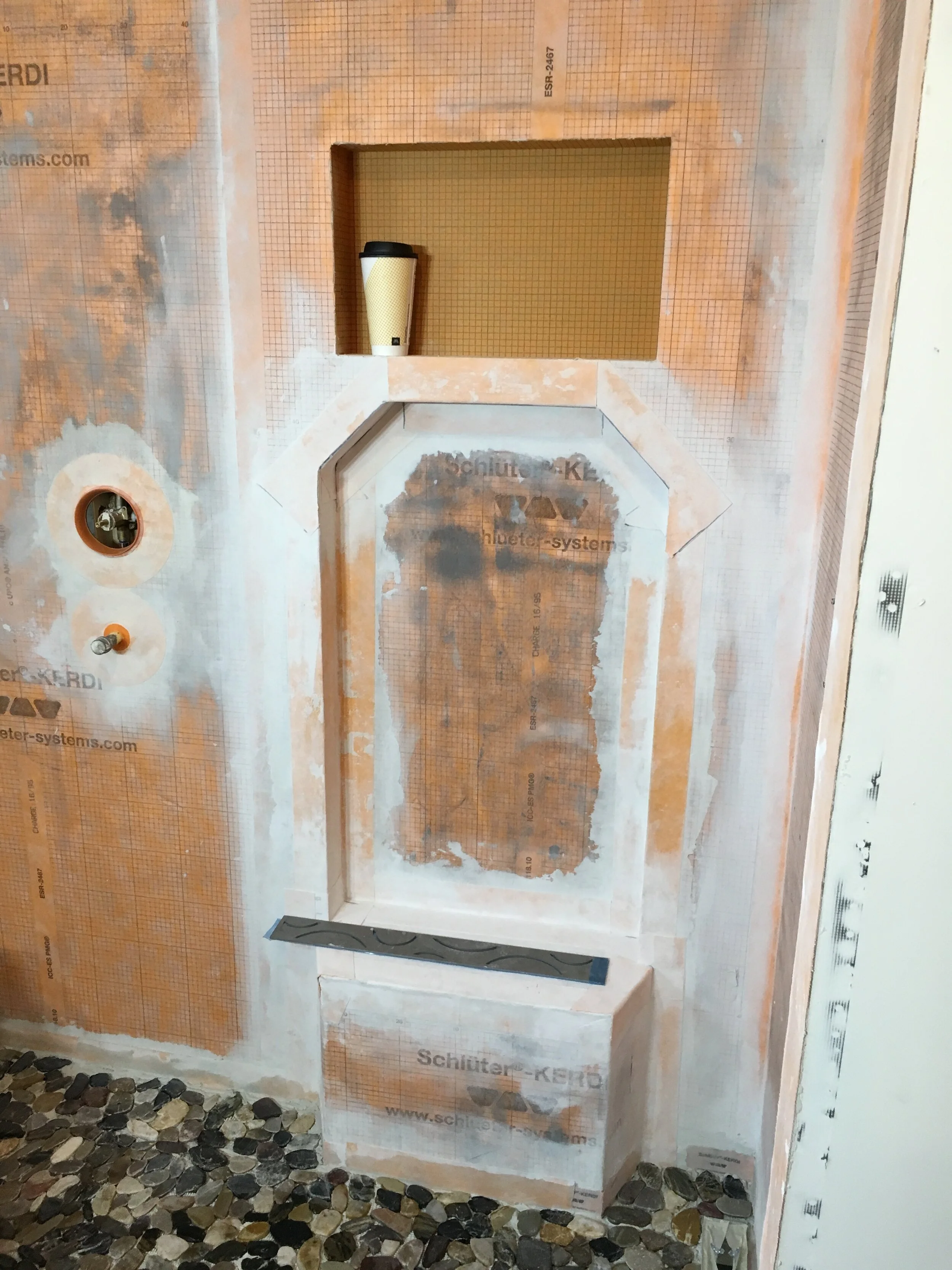  The owner designed a shower seat and plumbing fixtures for a standing shower to open up the space. 