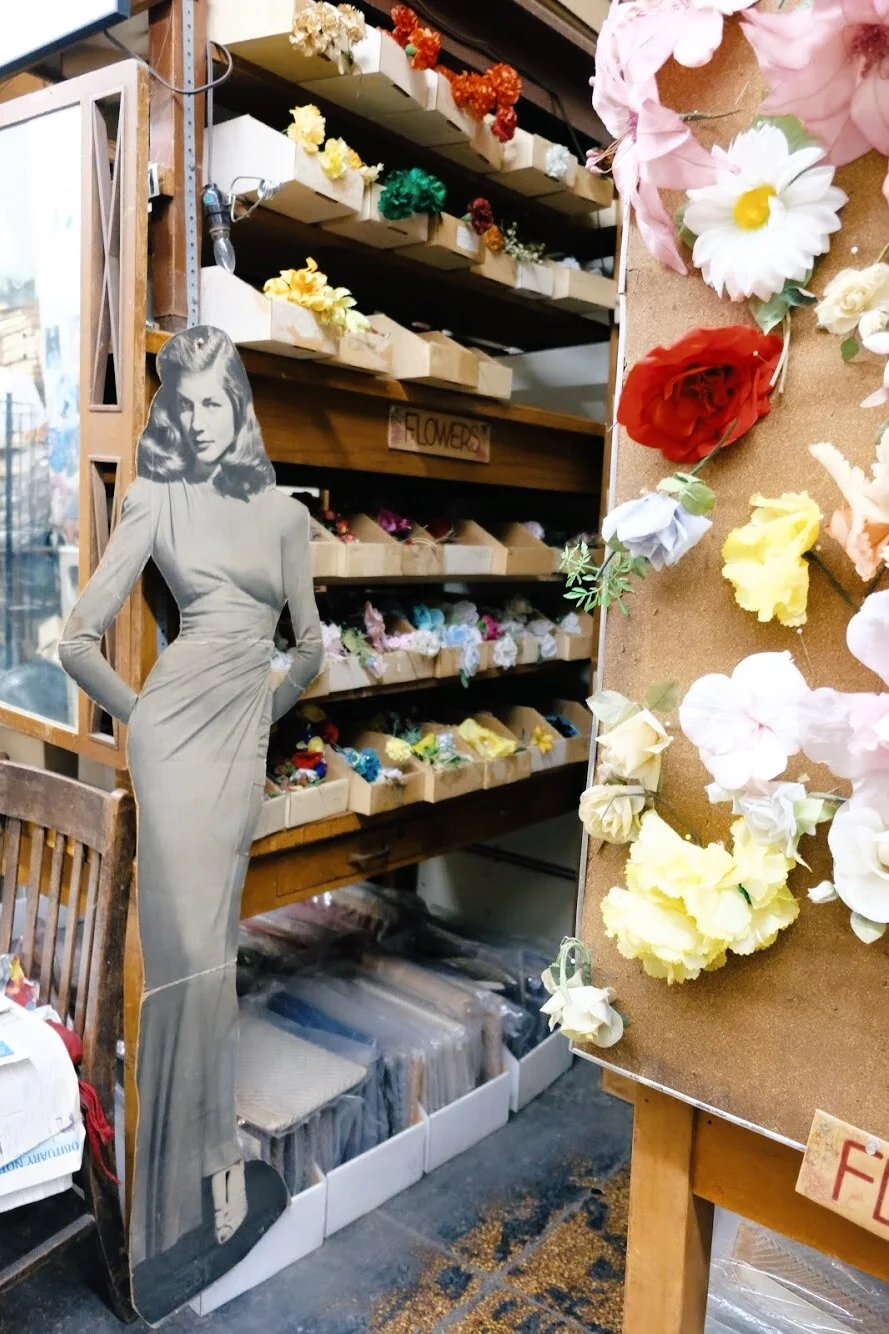 Lauren Bacall hanging out amongst the flower trimmings at California Millinery. (2019)