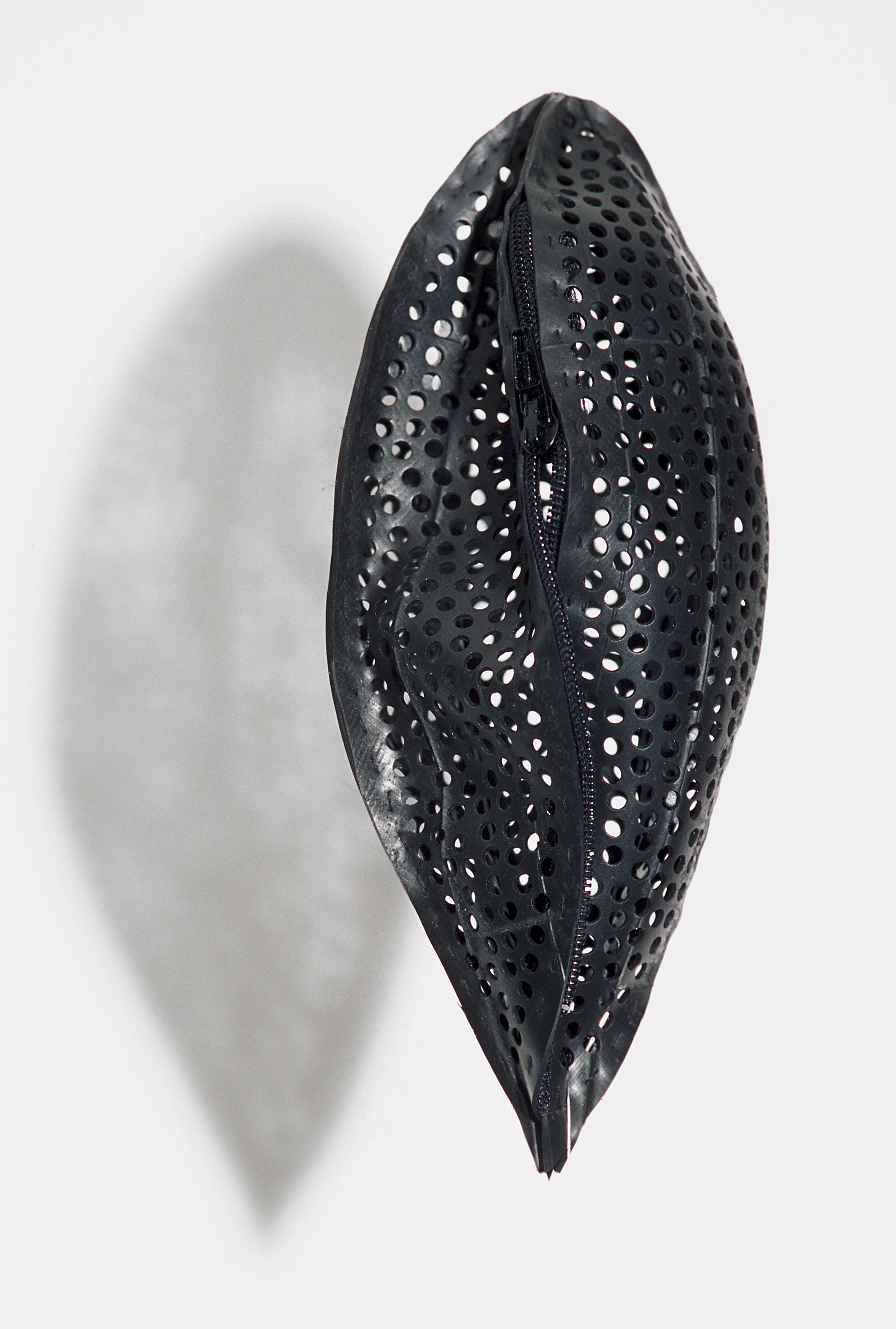 Sarah Rayner. Involvo Evolvo. Craft Queensland (Artisan Gallery). 2001. Inner tyre tube and zipper. Photograph by Don Hildred.