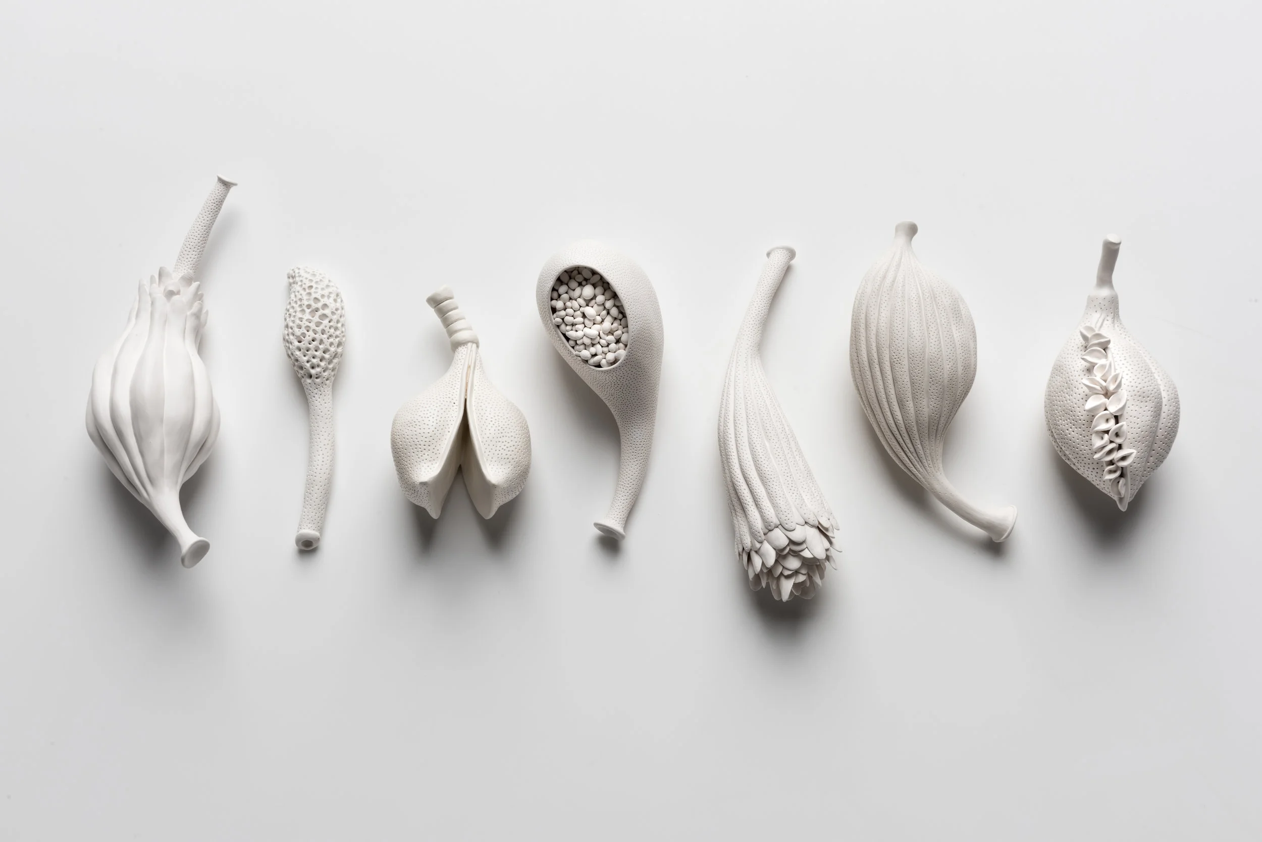 Sarah Rayner, A short story from a long tale , 2018, hand carved porcelain, Terra Sigillata, 1000c, Collective dimensions h.6cm, w.35cm, d.12cm, Photo: Greg Piper.