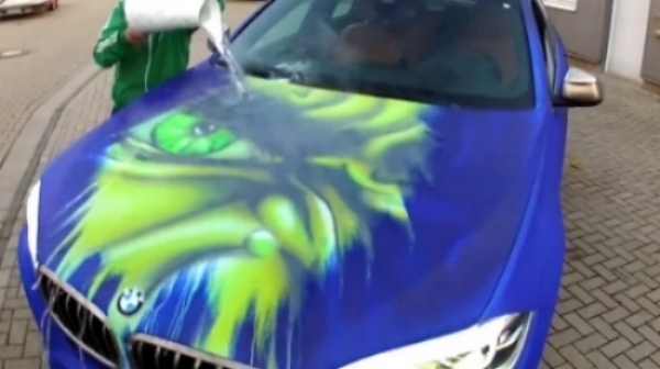 “The Hulk” appears when hot water is being poured onto the car. Image source: https://nerdist.com/watch-a-bmw-turn-into-the-hulk-when-splashed-with-hot-water/