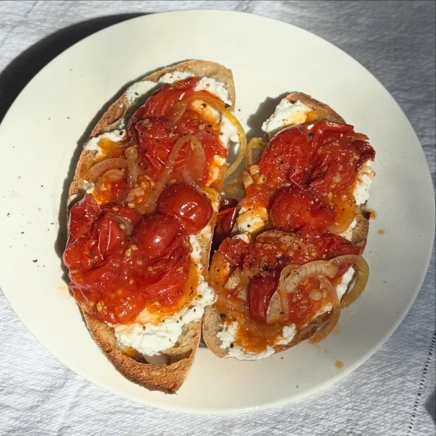 I think this is the best brekky I&rsquo;ve had for ages: sourdough toast, Curdy, and roasted cherry tomatoes. 

Tomatoes: cherry toms in a baking dish, whole. Thinly sliced onion, 3 finely diced garlic cloves, a splash of olive oil, salt. Roasted at 