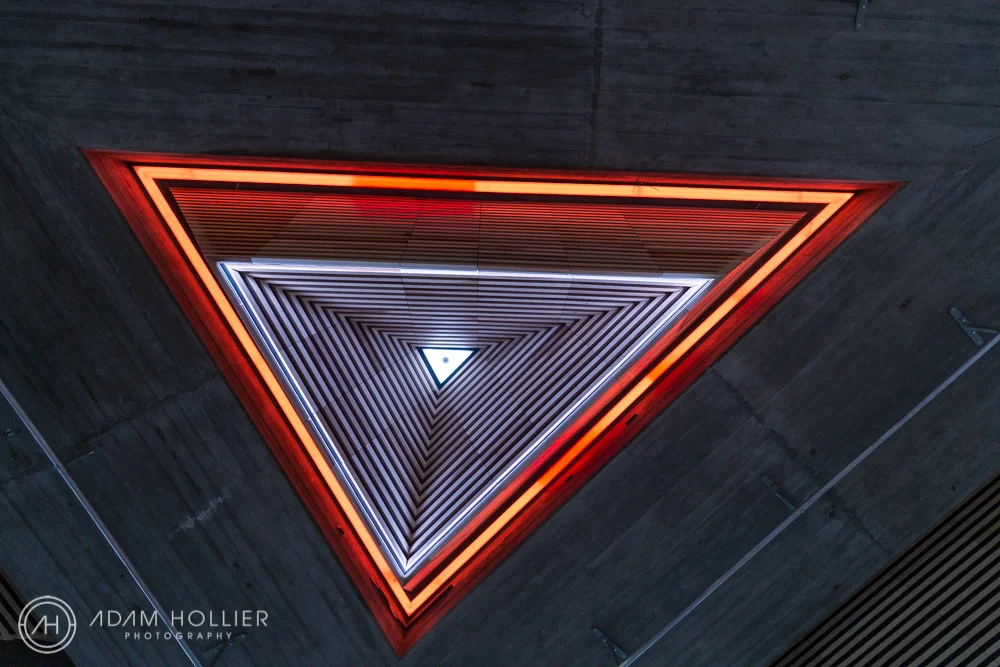 This was taken at the newly refurbished South Bank Centre in London. The company which commissioned me had been responsible for the carpentry on these multi-coloured ceiling lights.
