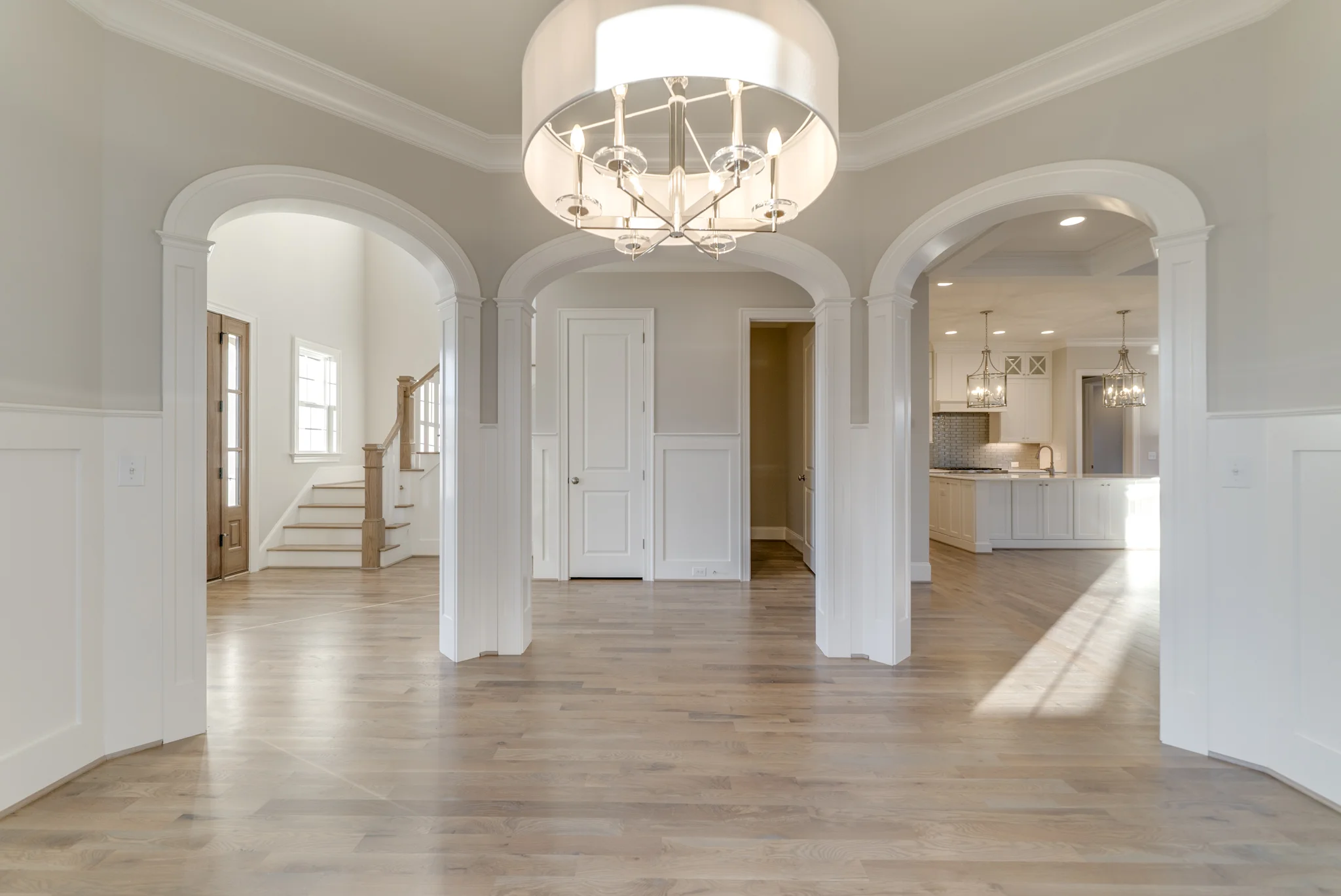 Arched openings in dining room - ellipticals - 5” casing detail with panel columns
