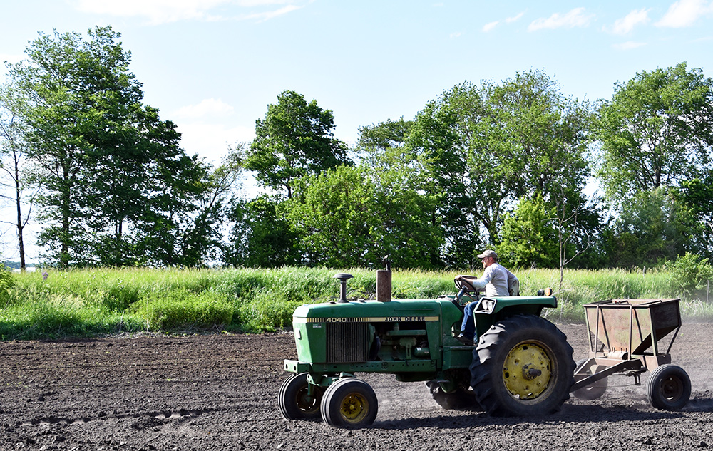Our neighbor Joe helping with planting