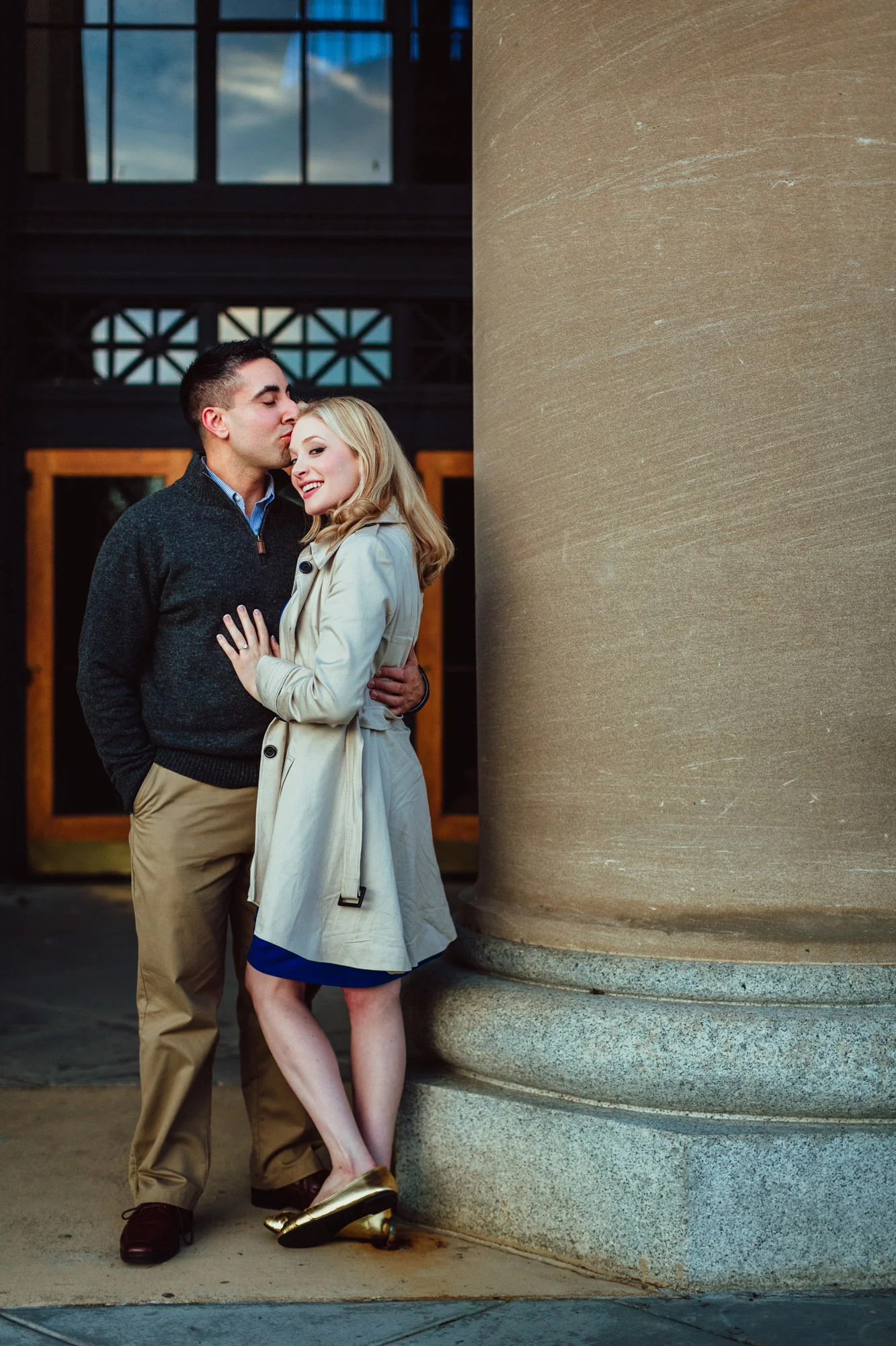 couple hugging next to column.jpg