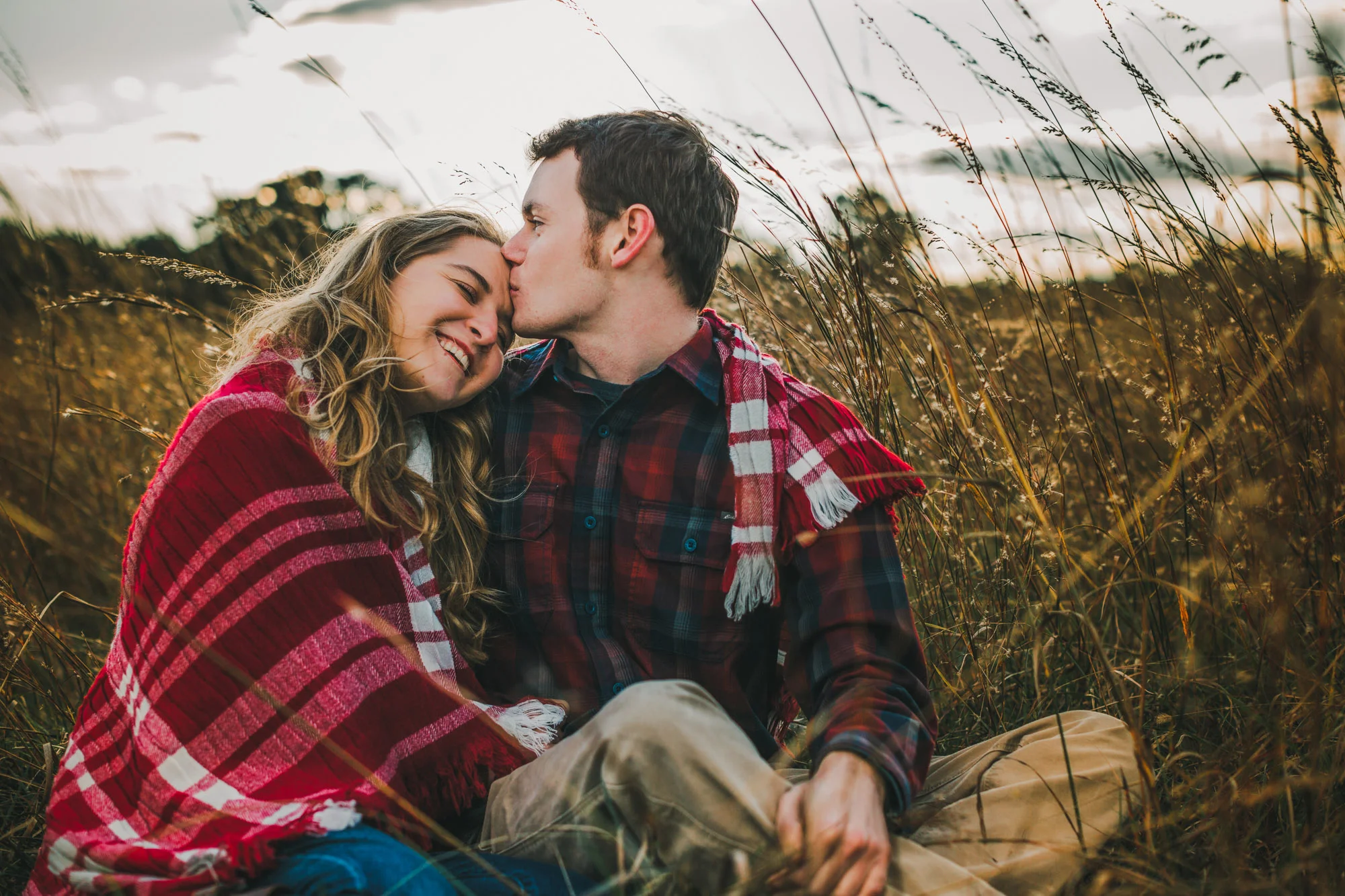 couple kissing in grass.jpg
